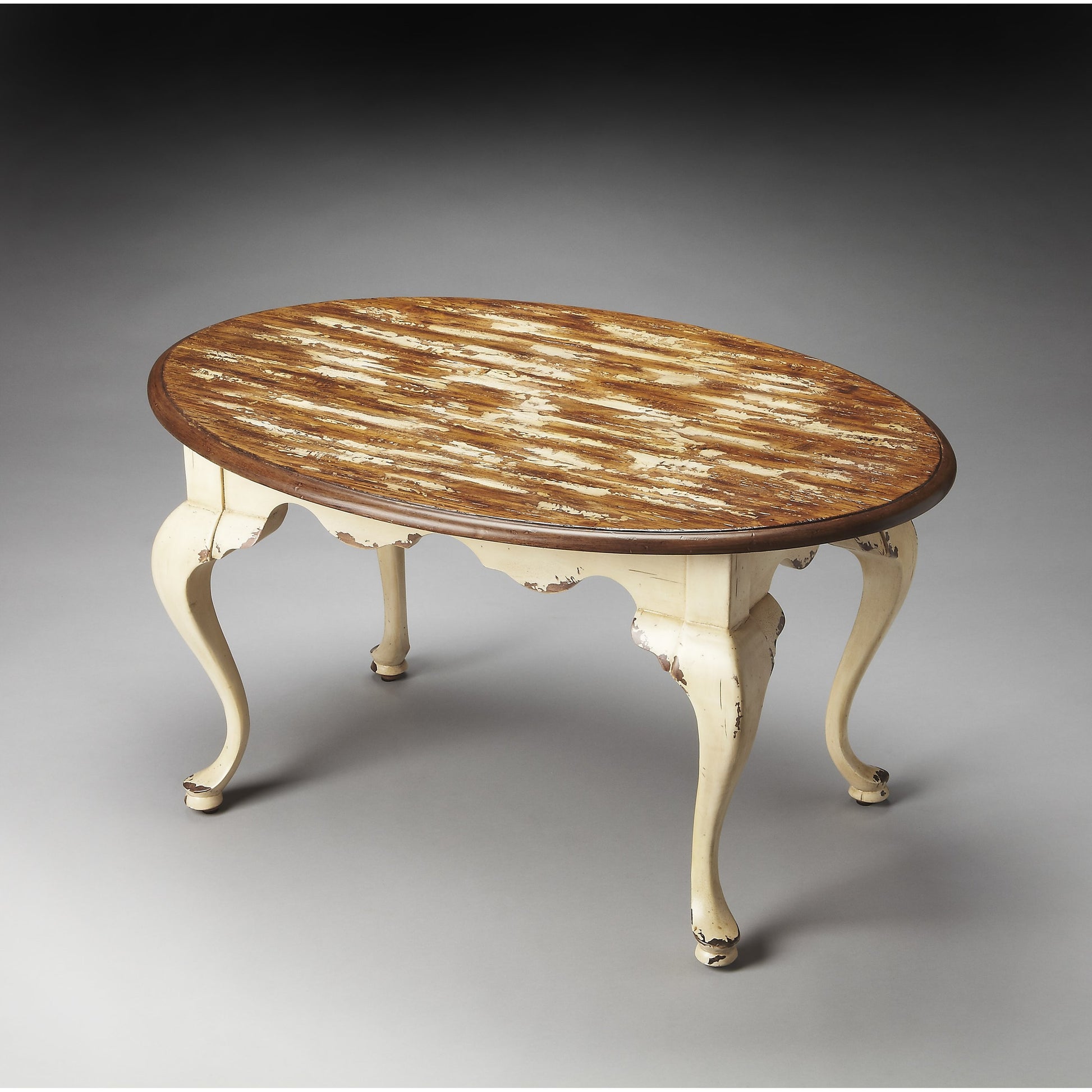 Grace Oval Cocktail Table by Butler Specialty Company. Made from rubberwood solids, mdf, cherry, maple, walnut veneers in a traditional style.