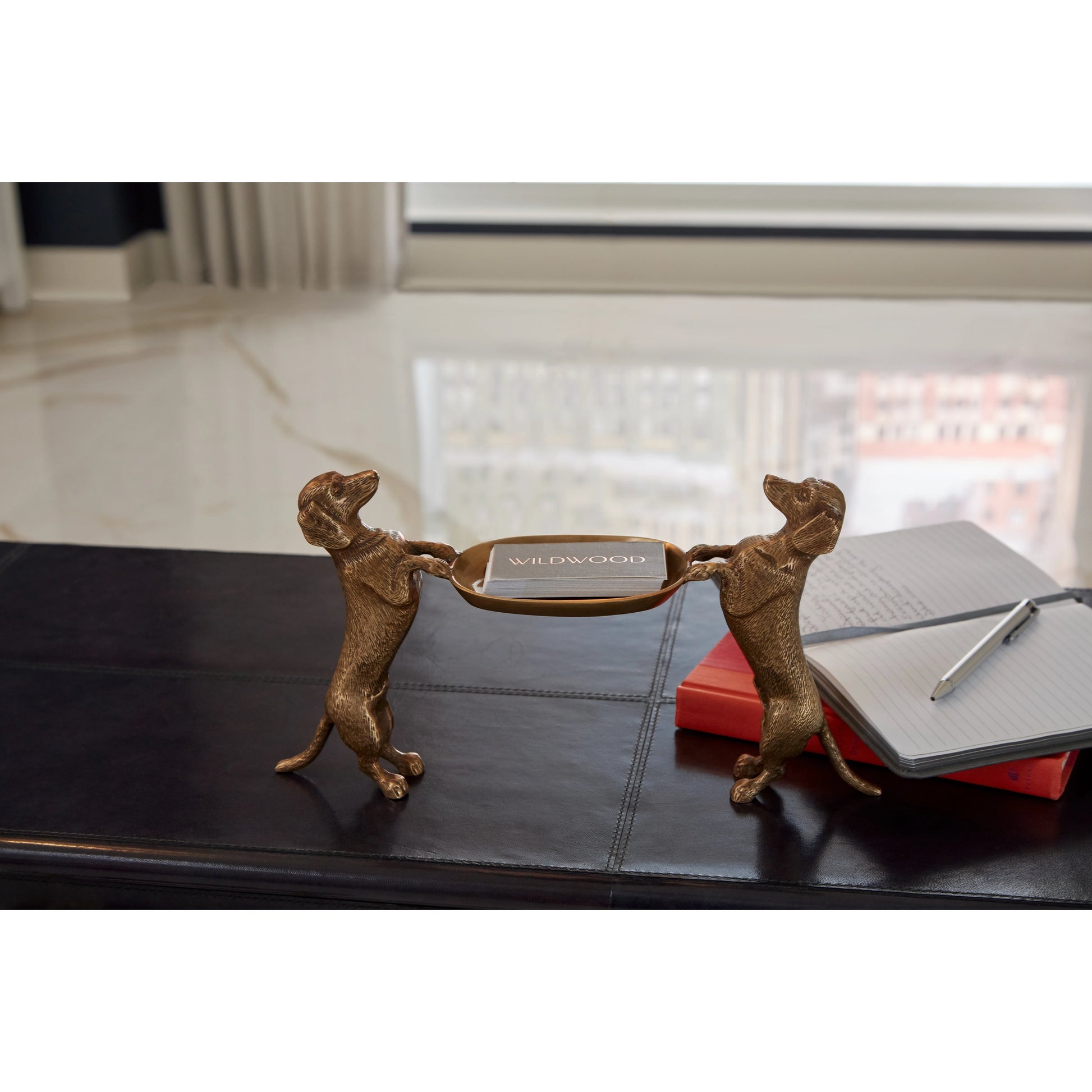 Brass Dachshund by Wildwood in antique. Made from brass in a traditional style.