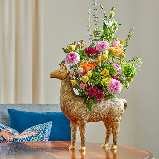 Drama Llama Planter by Wildwood in gold. Made from aluminum in a modern style.