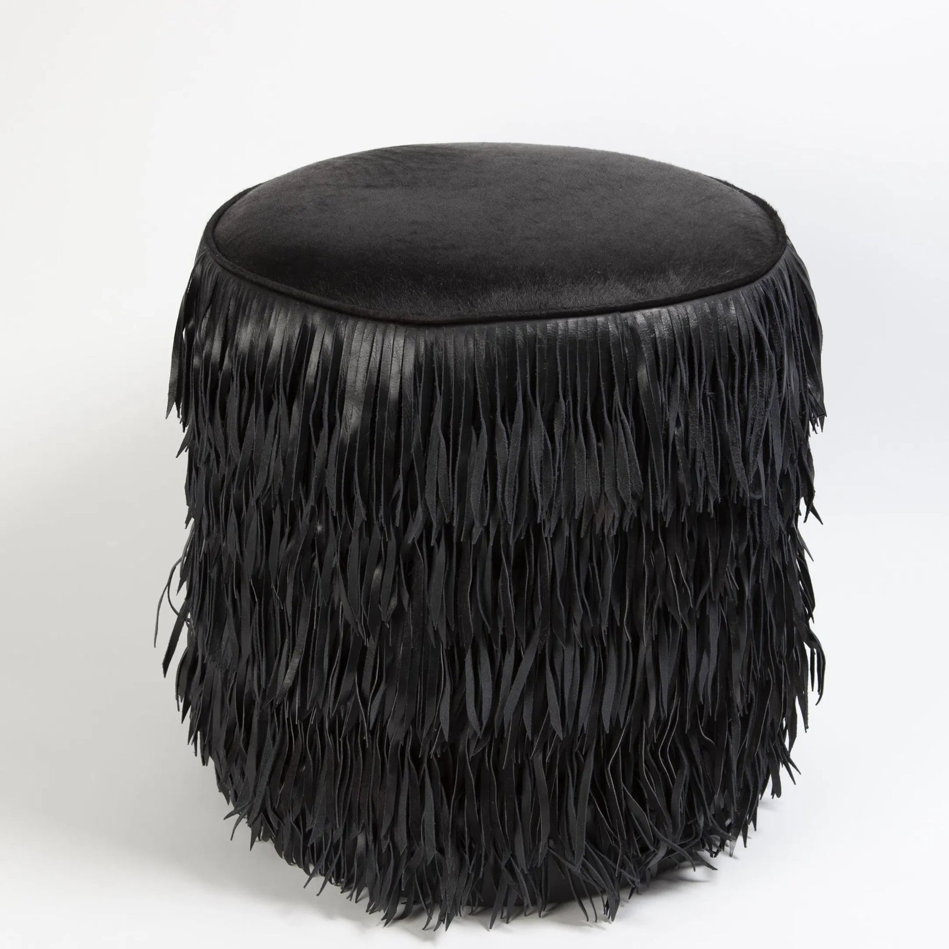 Fringe Ottoman by Global Views. Made from mdf, leather, pvc in a unique style.