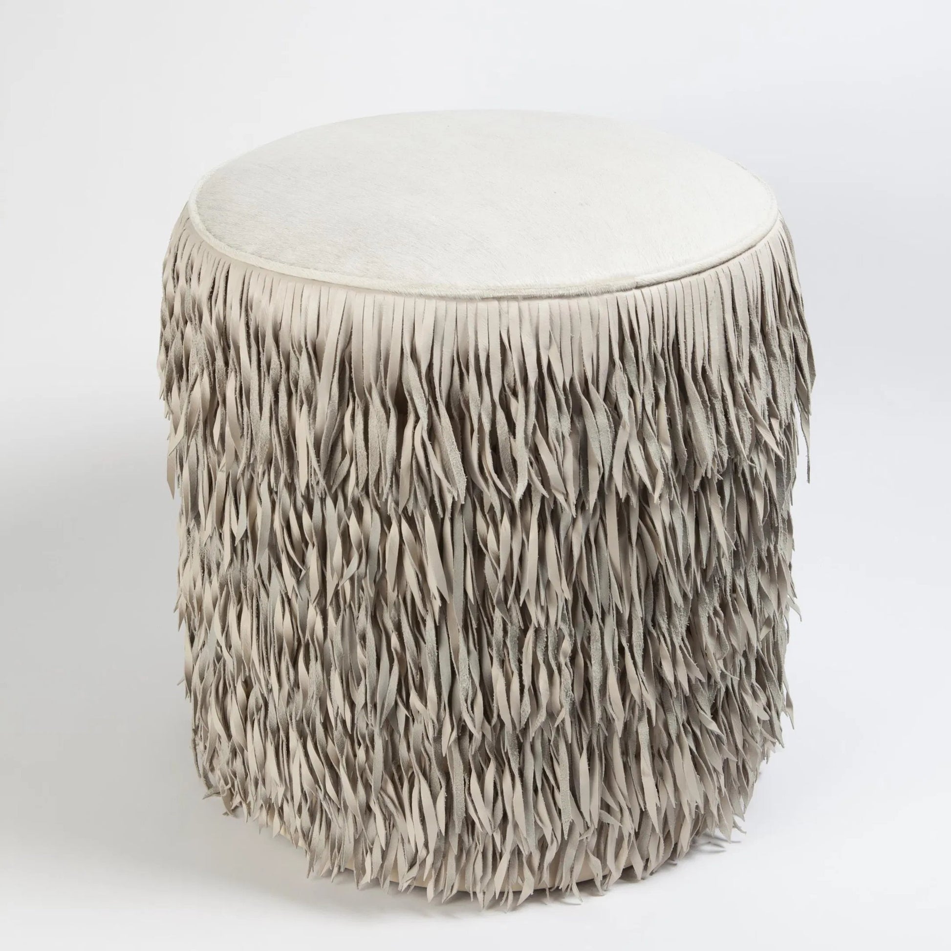 Fringe Ottoman by Global Views. Made from mdf, leather, pvc in a unique style.