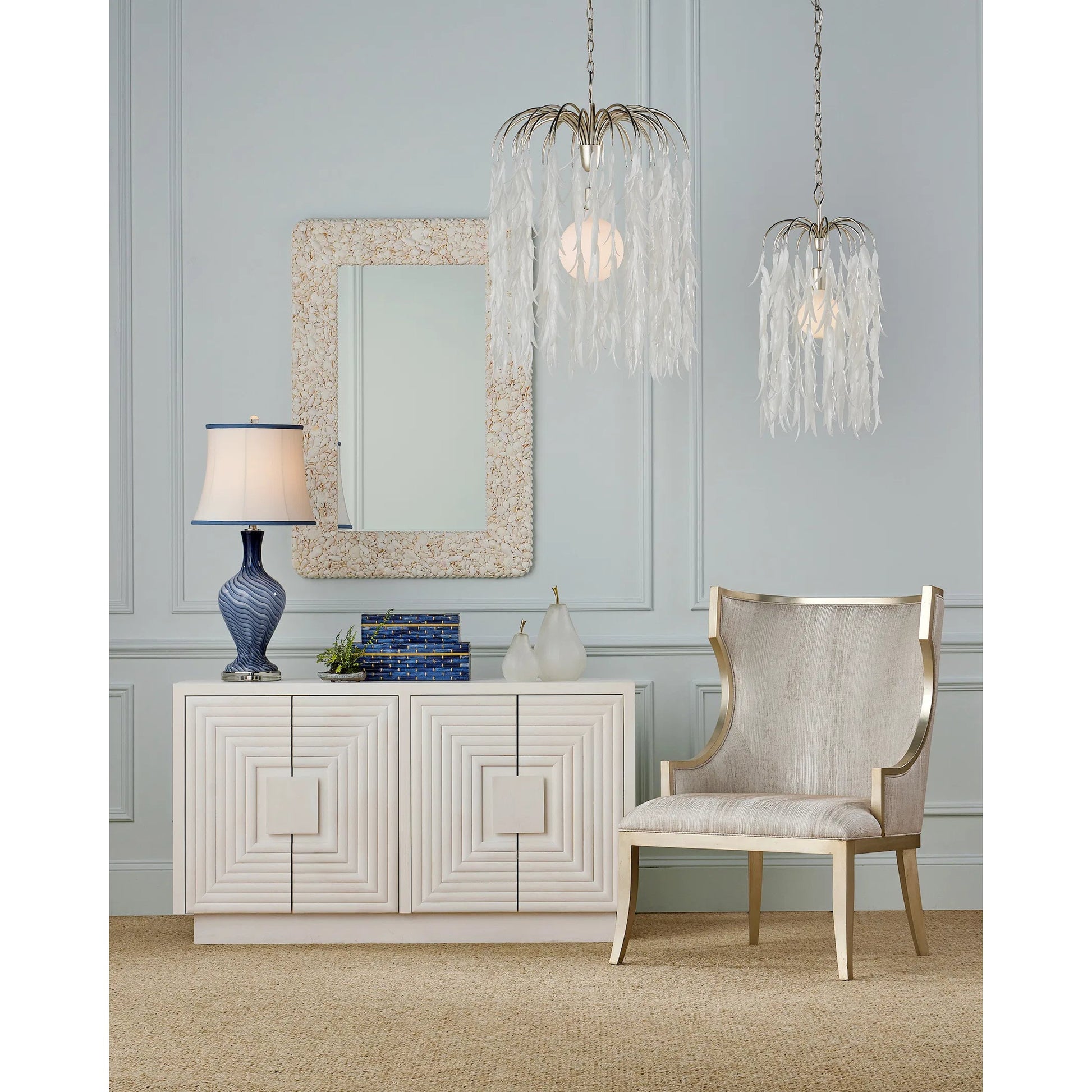 Morombe Cabinet by Currey and Company in cerused white. Made from white oak in a eclectic & global style.