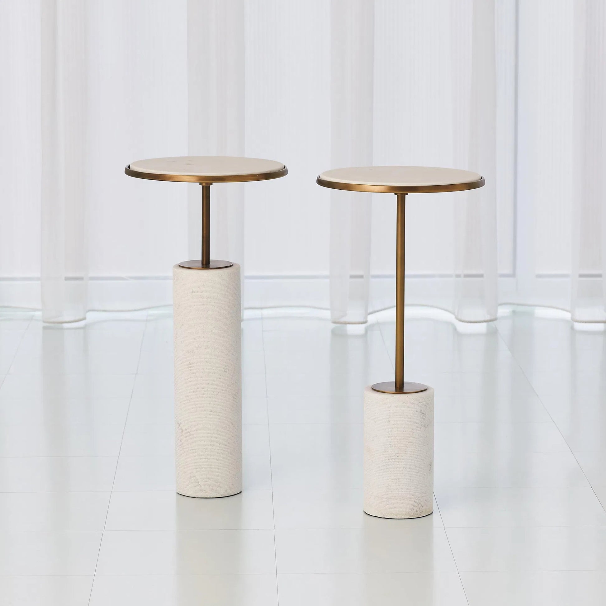 Tall Cored Marble Table by Global Views. Made from brass, marble in a transitional style.