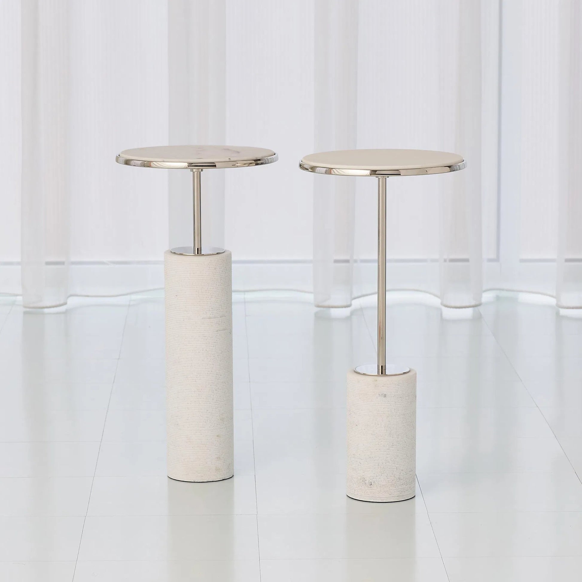 Tall Cored Marble Table by Global Views. Made from brass, marble in a transitional style.