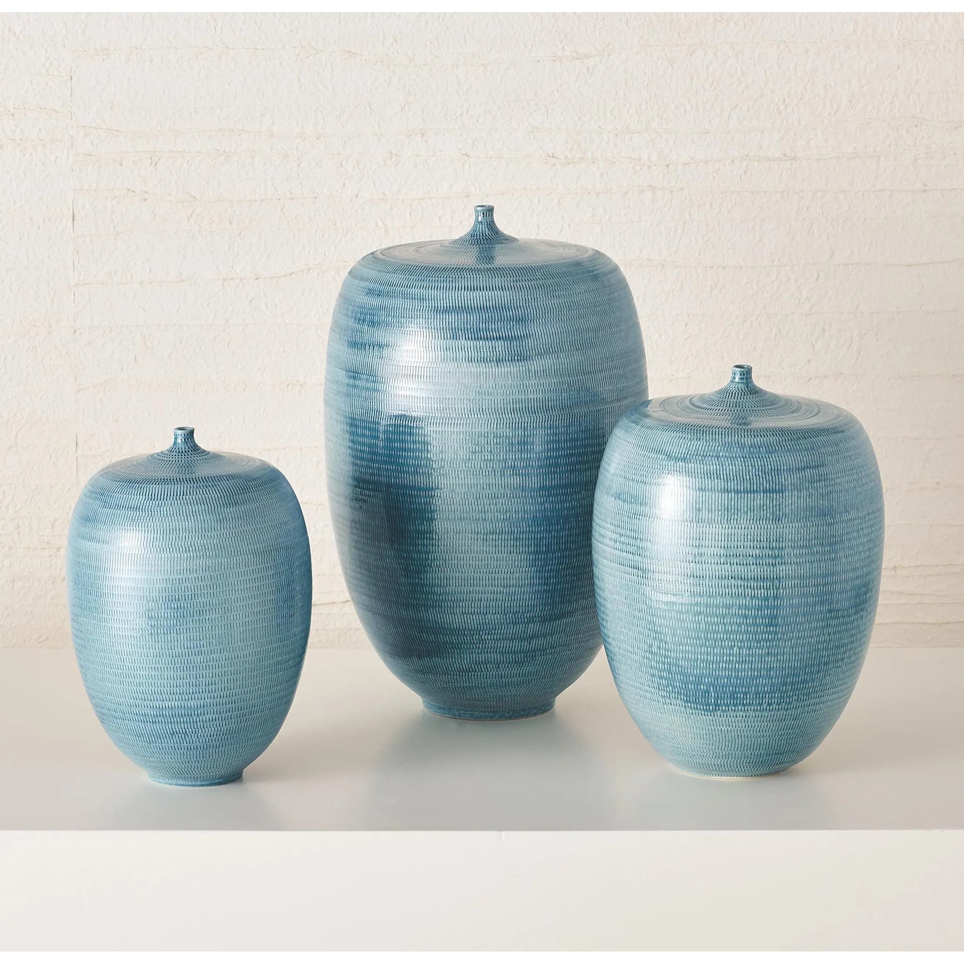 Fat Bottle by Global Views. Made from porcelain in a coastal style.