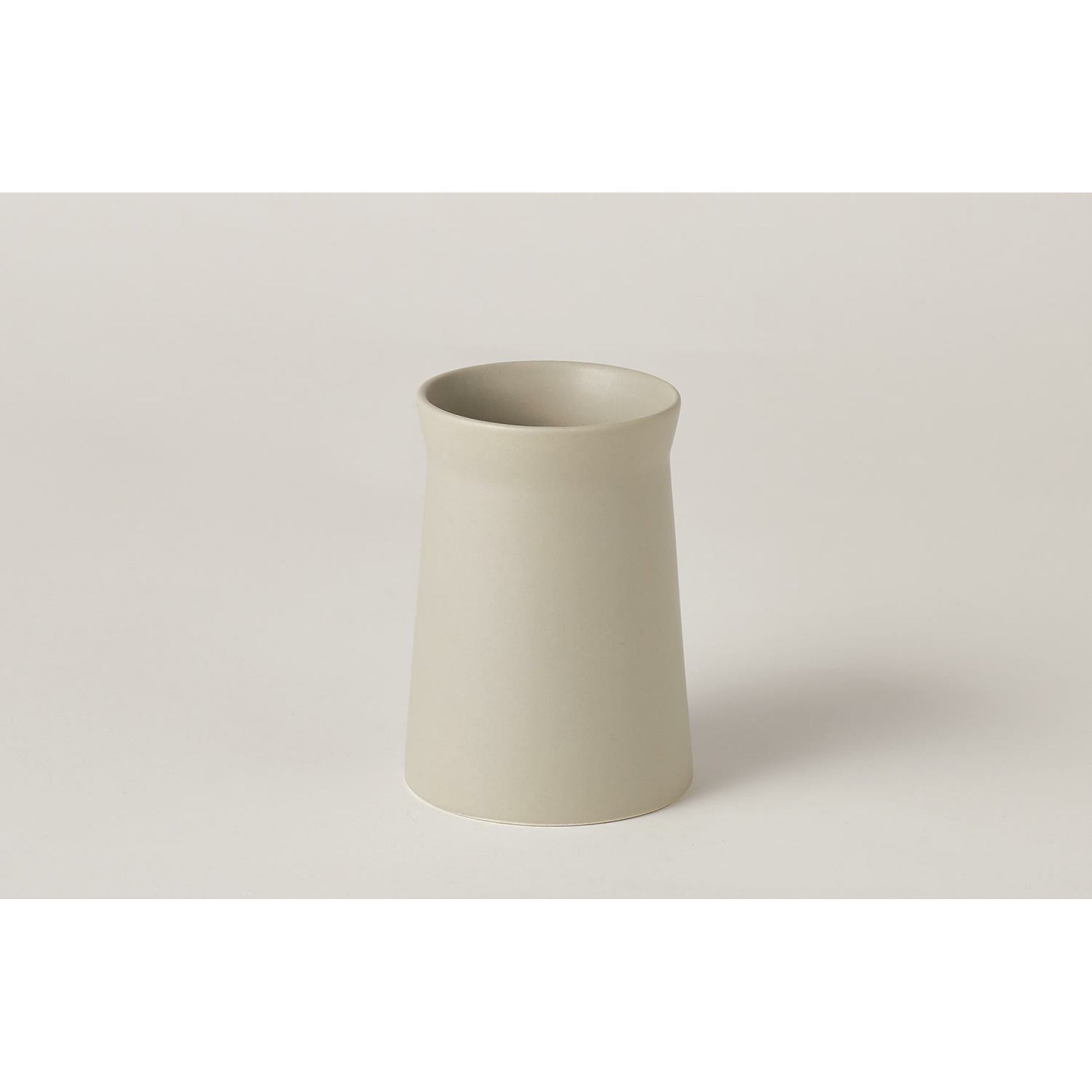 Soft Curve Vase by Global Views in white. Made from ceramic in a modern style.