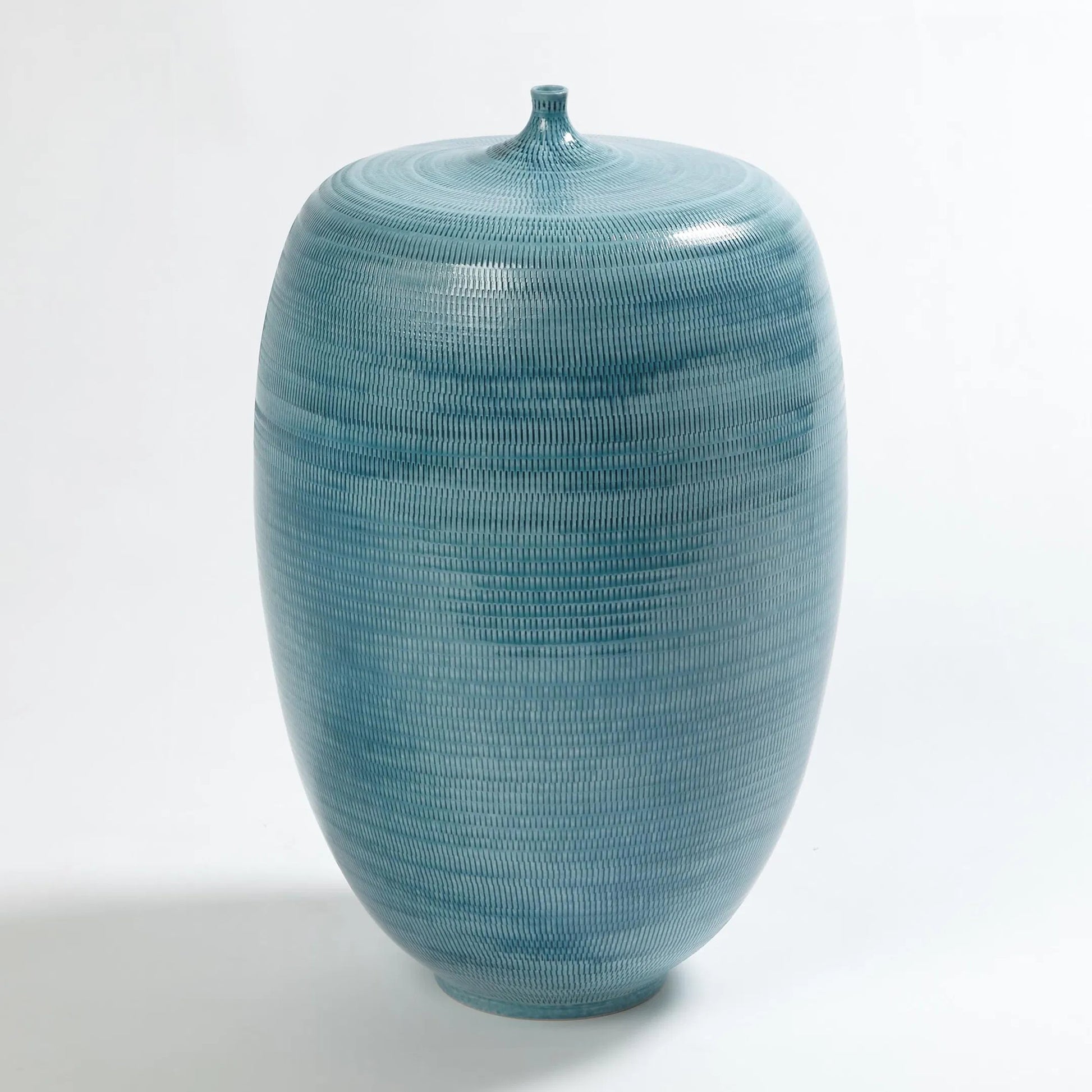 Fat Bottle by Global Views. Made from porcelain in a coastal style.