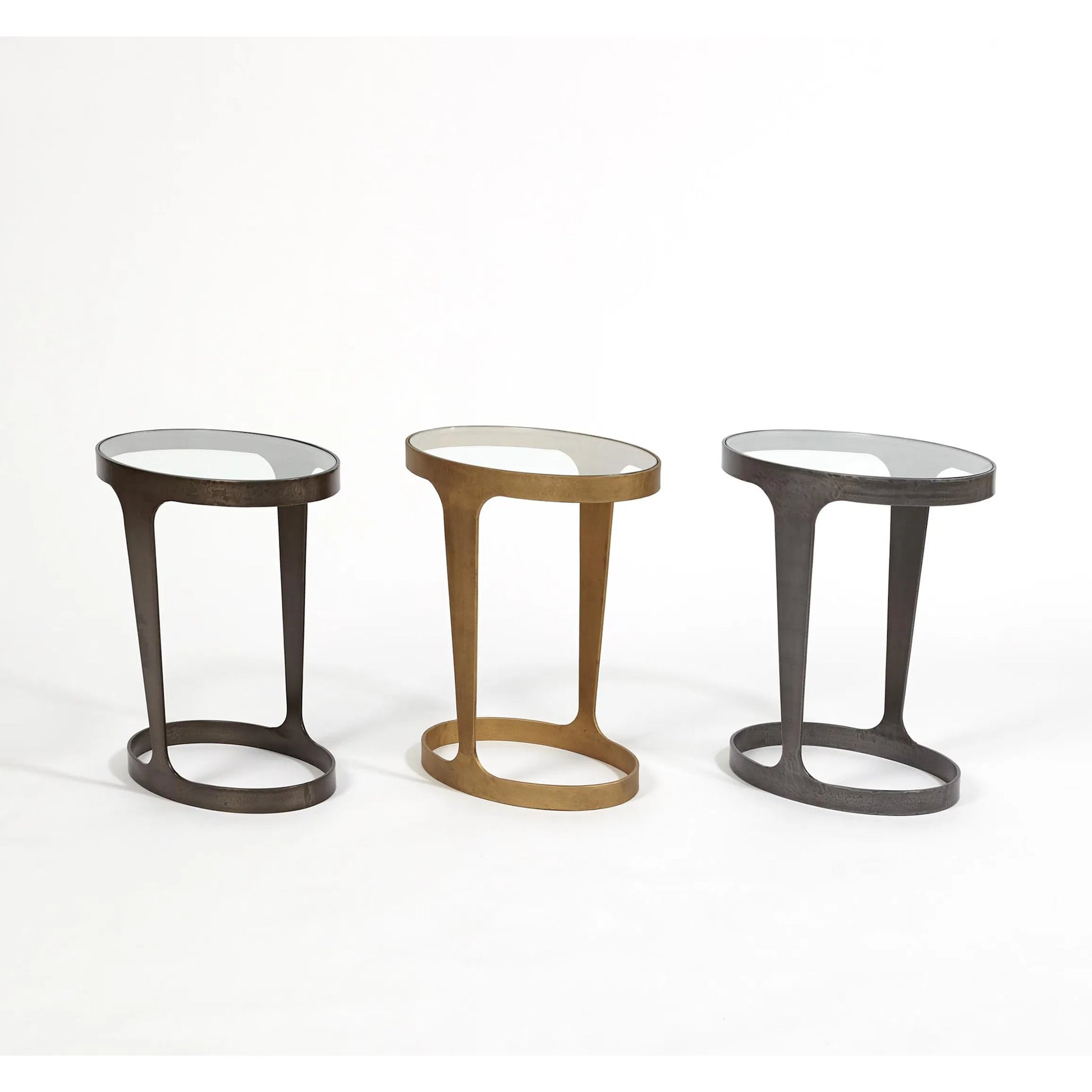 Oslo Accent Table by Global Views in gold. Made from iron, tempered glass in a eclectic & global style.
