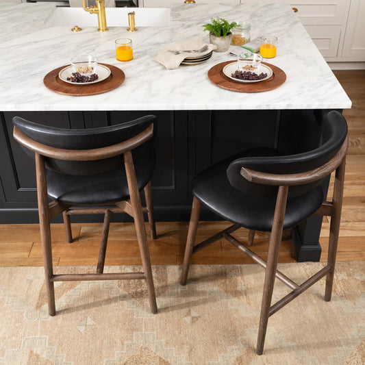 Ethan Leather Counter Stool by Regina Andrew in black. Made from wood in a traditional style.