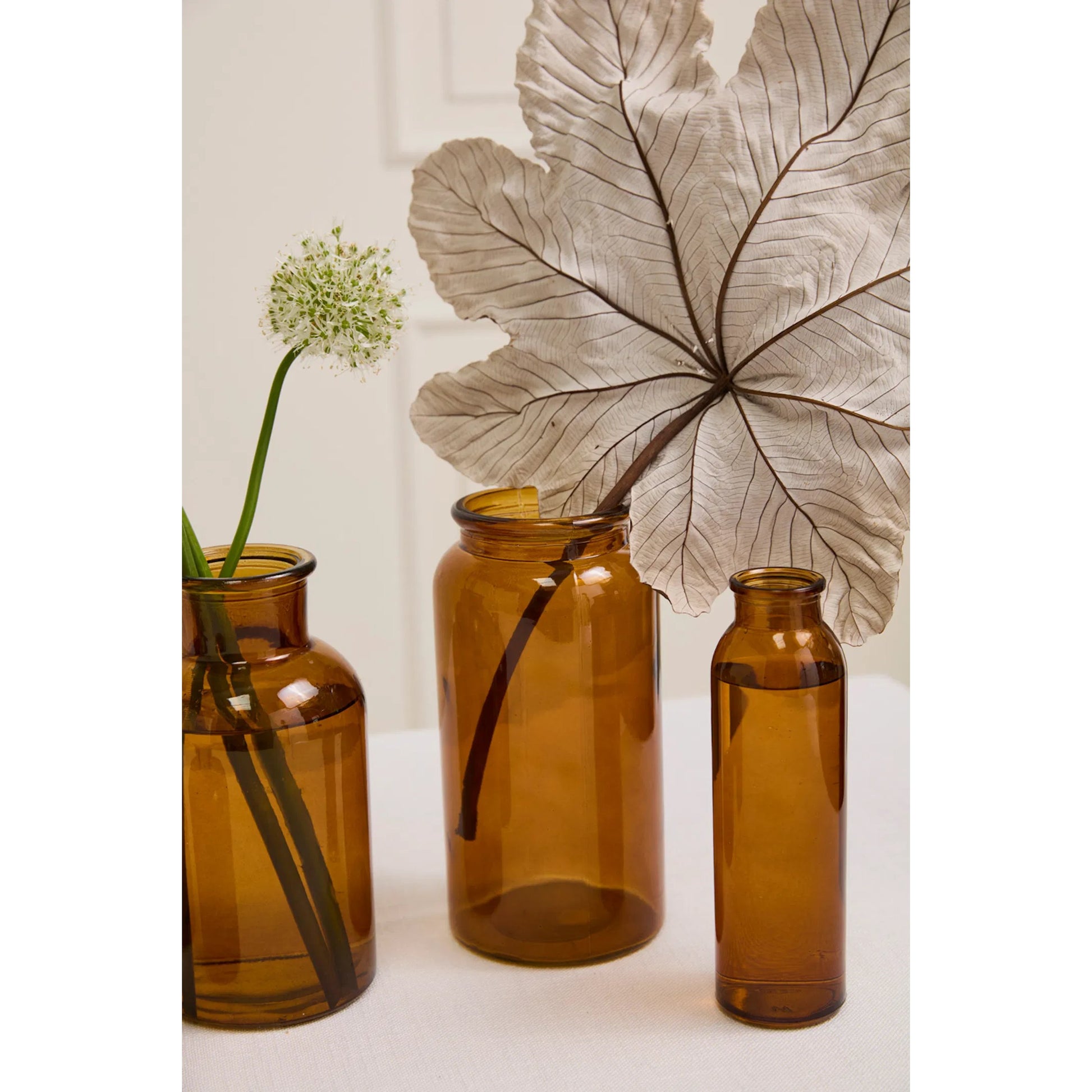 Amber Billie Bottle by Accent Decor in amber. Made from glass in a unique style.