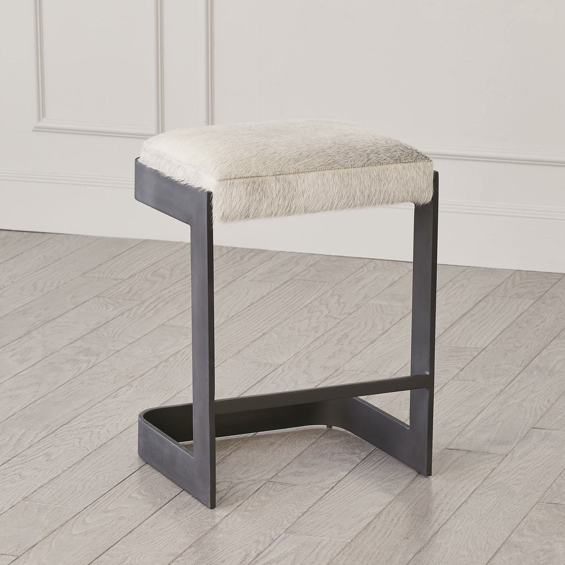 Regan Low Bar Stool with Grey Hair by Global Views. Made from iron in a modern style.