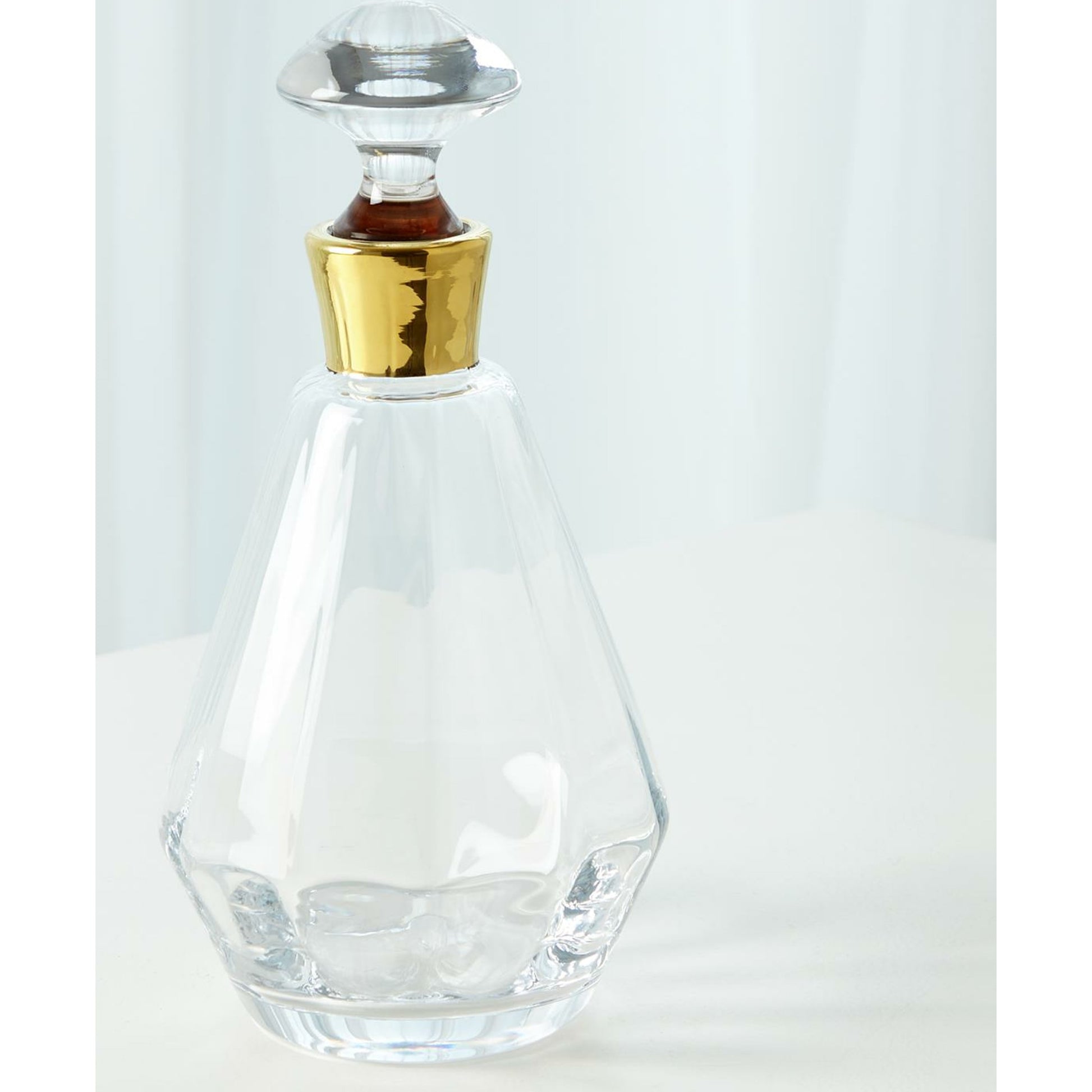 Cone Decanter by Global Views. Made from glass in a transitional style.