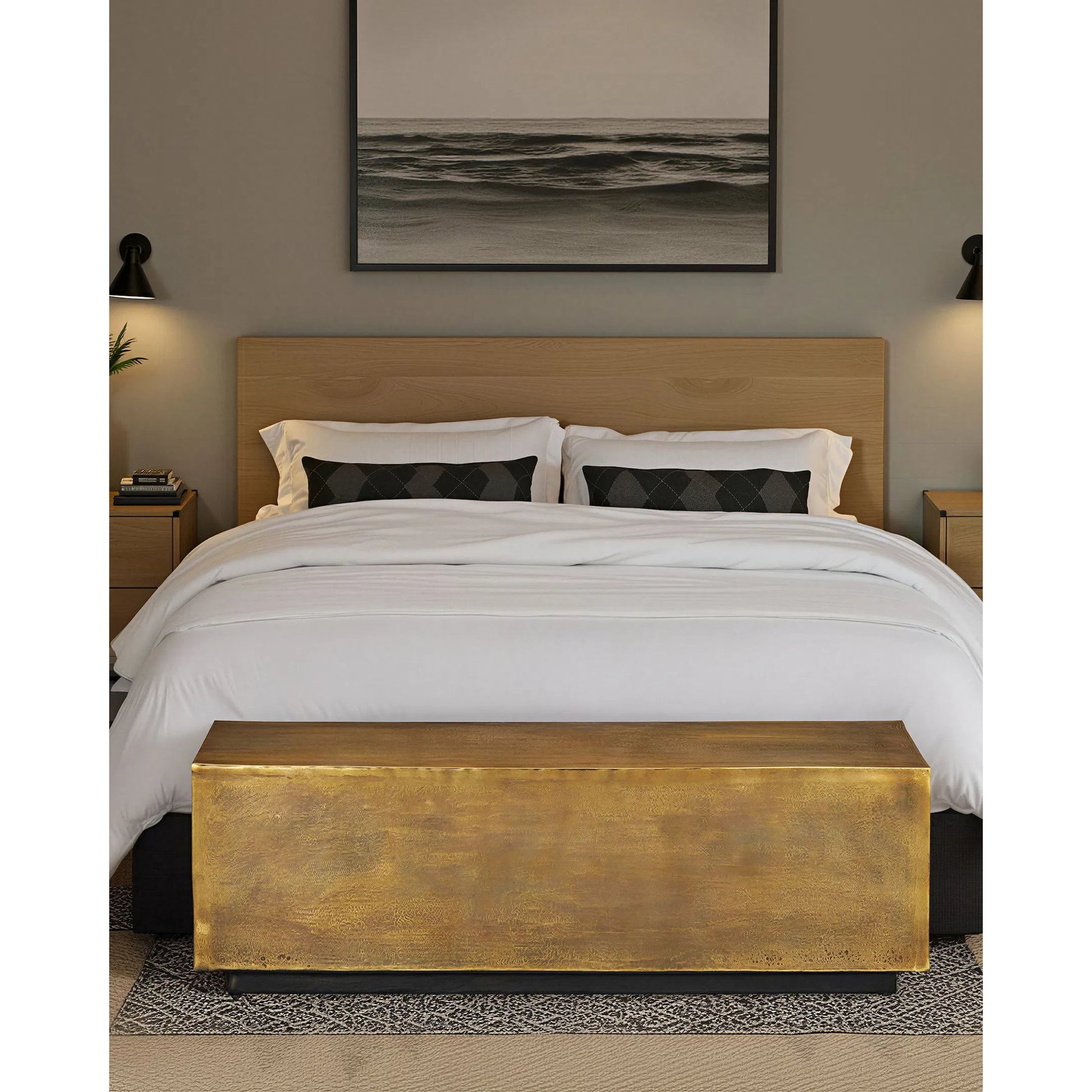 Jahnu Bench by Currey and Company in antique brass. Made from cast aluminum in a modern style.