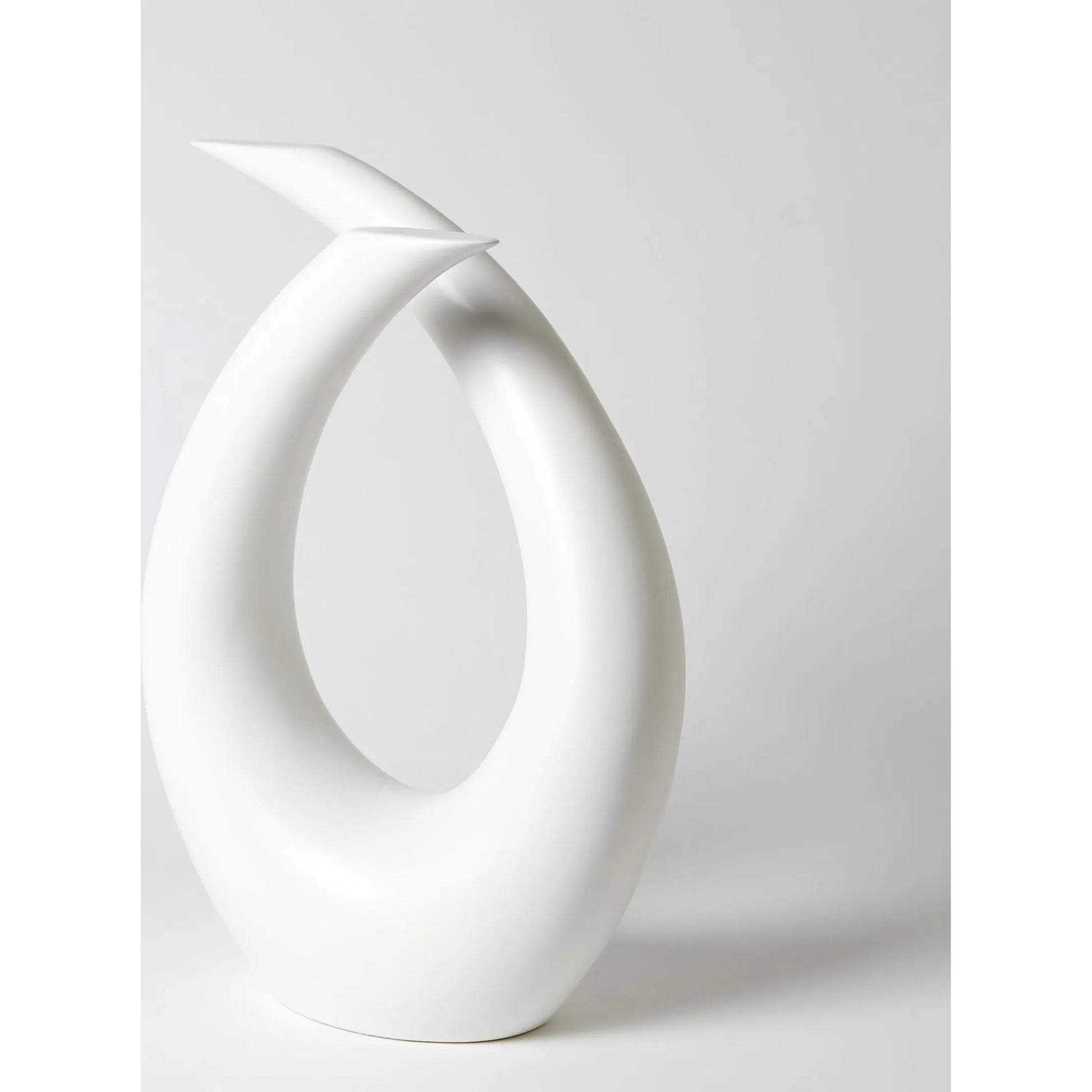 Loop Sculpture by Global Views. Made from ceramic in a modern style.