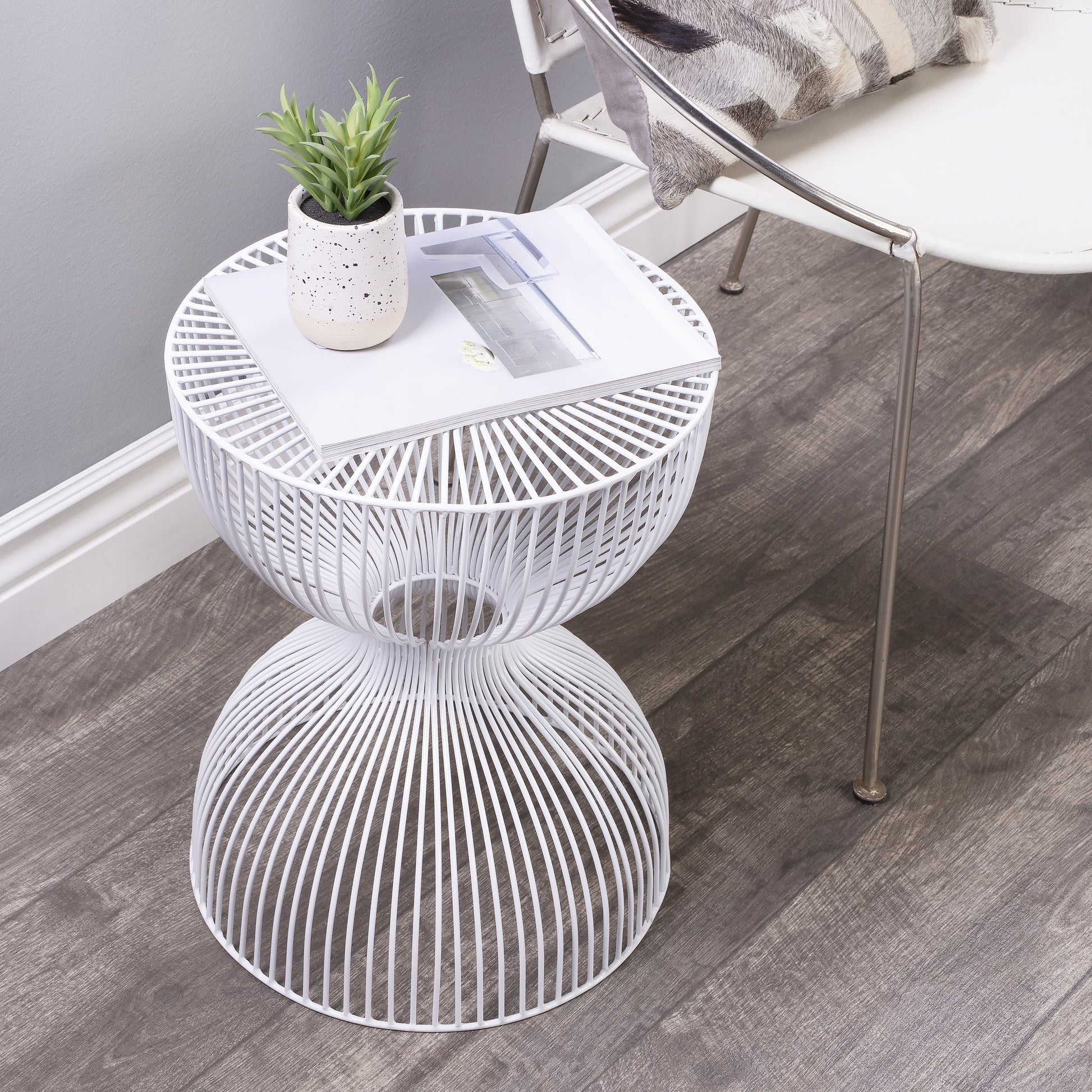 Nicholas End Table by Butler Specialty Company in metalworks. Made from iron in a modern style.