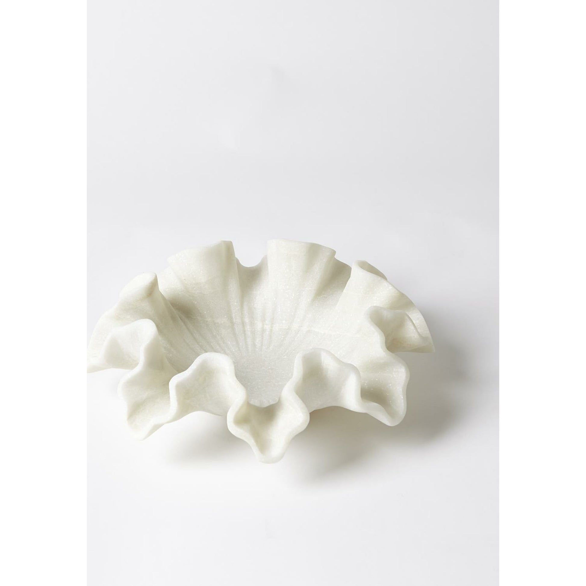 Marble Ruffle Bowl by Global Views in white. Made from rajnagar marble in a coastal style.