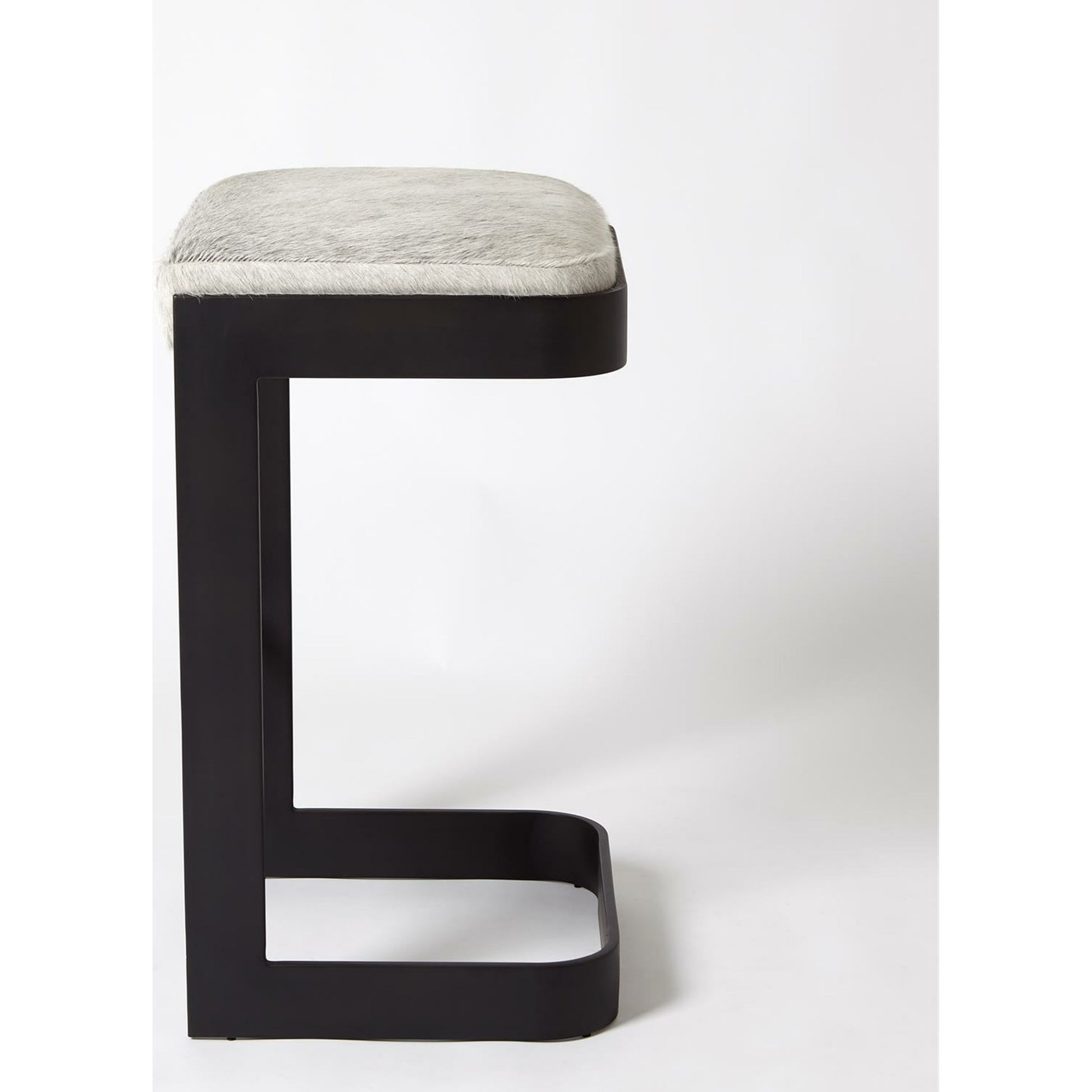 Regan Low Bar Stool with Grey Hair by Global Views. Made from iron in a modern style.
