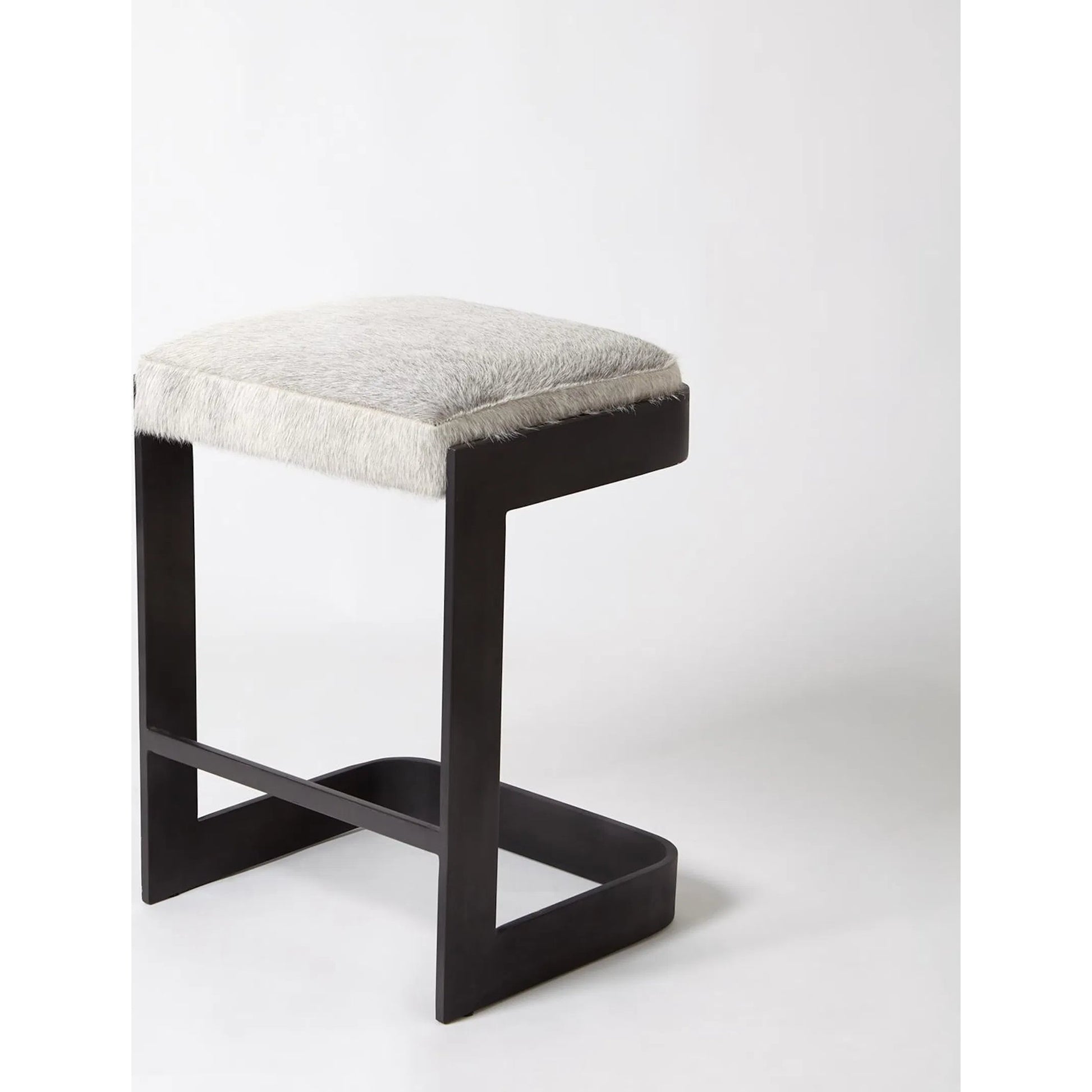 Regan Low Bar Stool with Grey Hair by Global Views. Made from iron in a modern style.