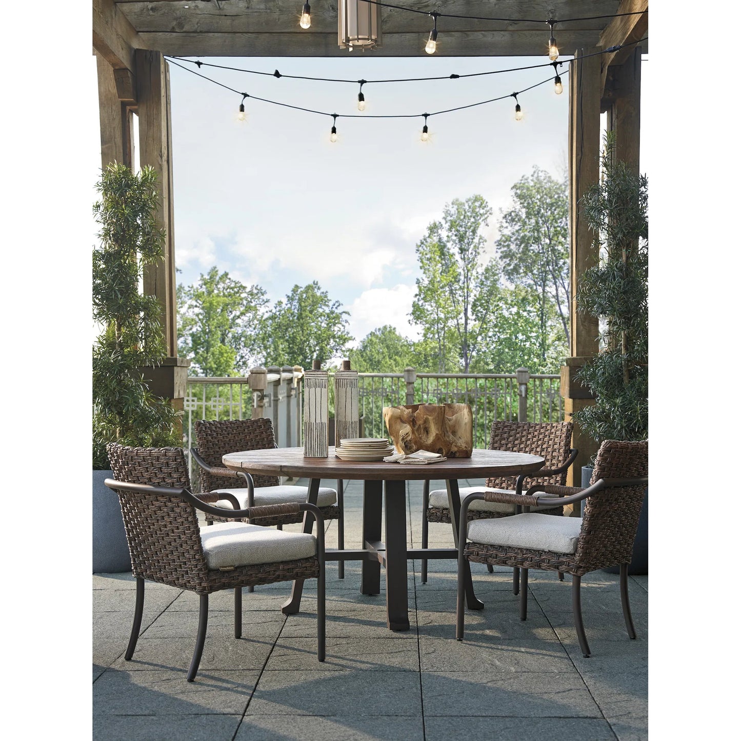 003 SI-2242608 | Lifestyle | Kilimanjaro Round Dining Table by Tommy Bahama Outdoor in tobacco. Made from unique in a rustic style.