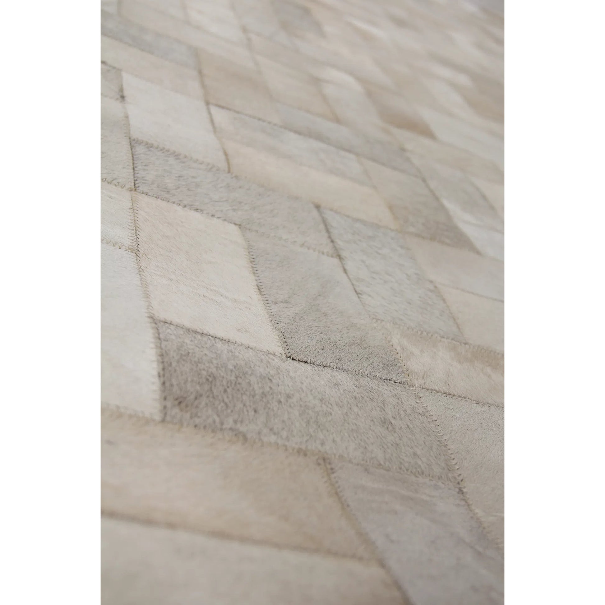 Natural Hide 3354 Rug by Exquisite Rugs in ivory, multi. Made from leather hide in a unique style.