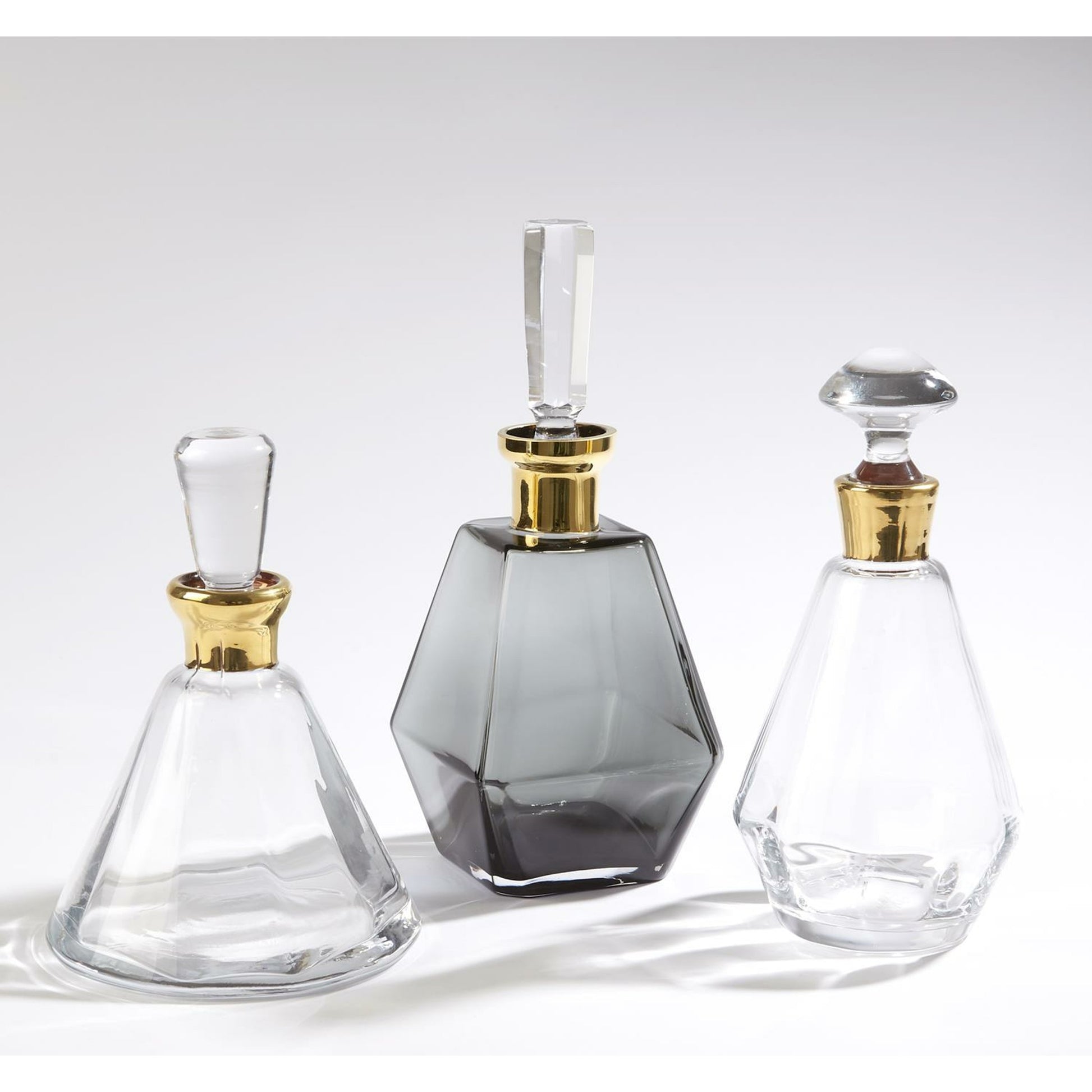 Cone Decanter by Global Views. Made from glass in a transitional style.