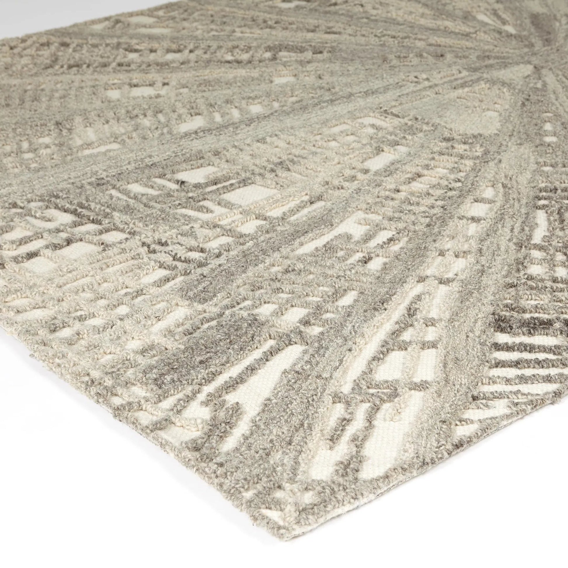 Vortex Rug by Global Views. Made from 100% wool, 100% cotton backing in a unique style.