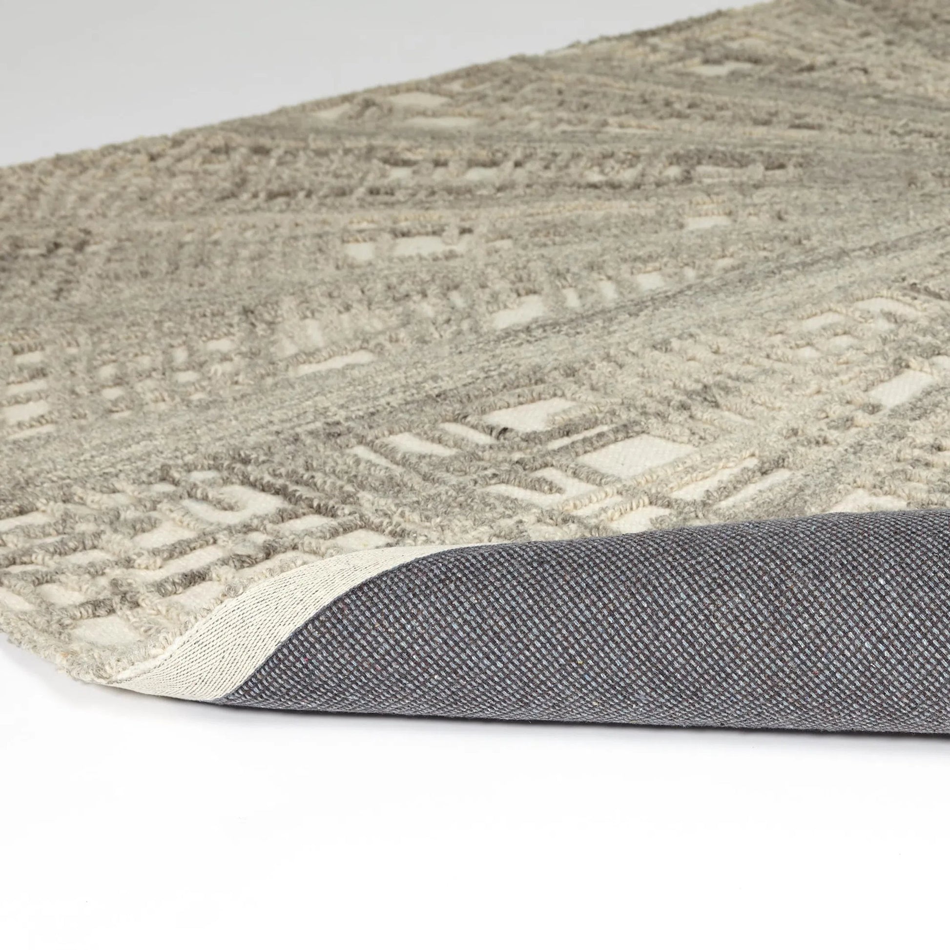 Vortex Rug by Global Views. Made from 100% wool, 100% cotton backing in a unique style.