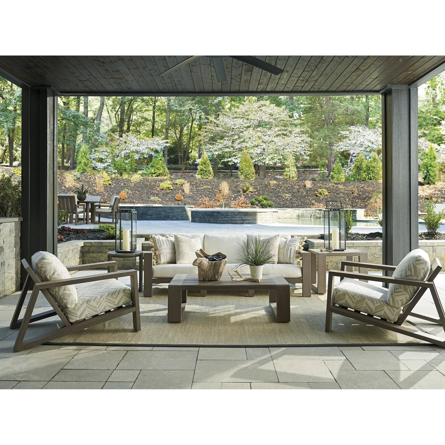 003 SI-2242648 | Lifestyle | Mozambique Rectangular Cocktail Table by Tommy Bahama Outdoor in taupe gray. Made from unique in a transitional style.