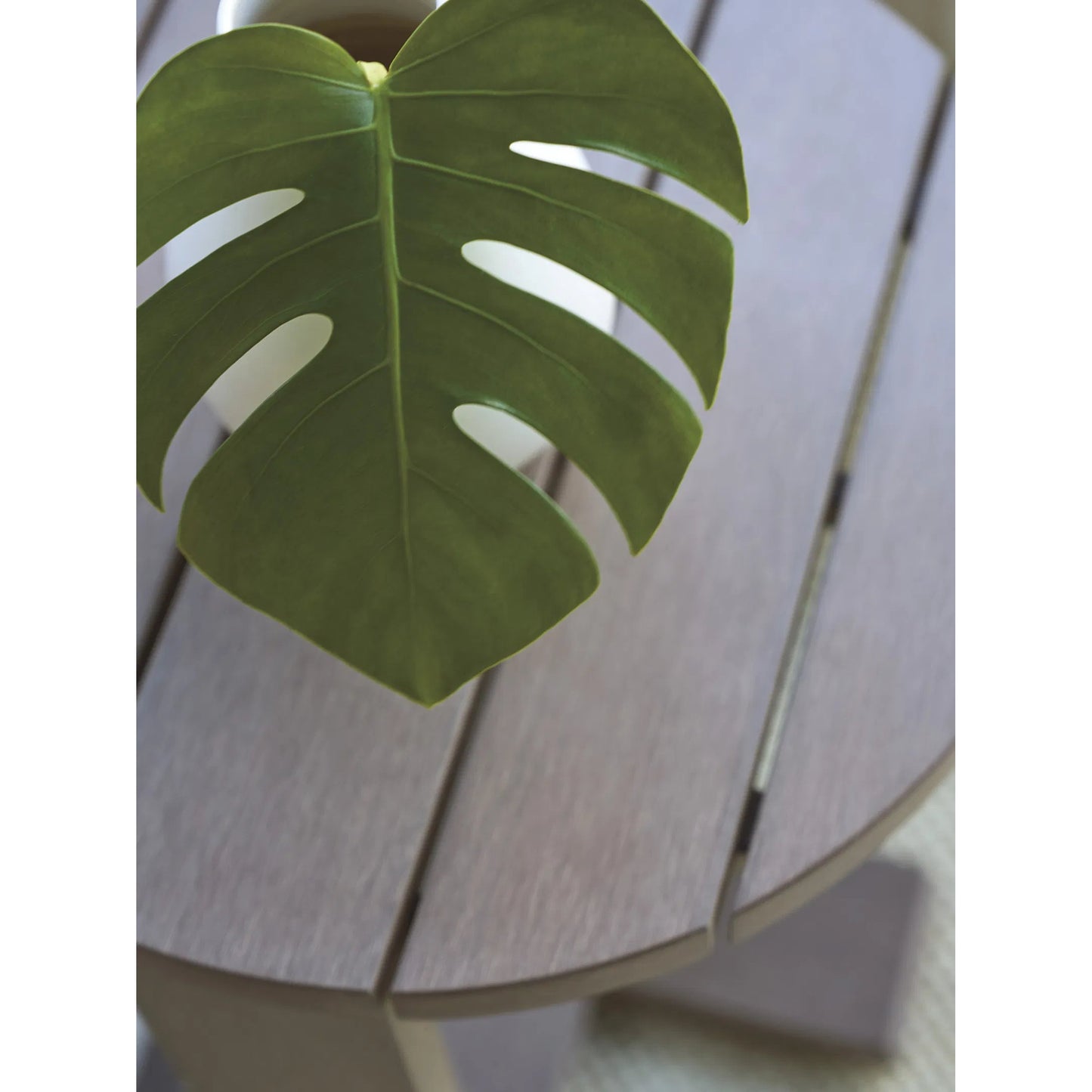 003 SI-2242649 | Closeup | Mozambique Round Side Table by Tommy Bahama Outdoor in taupe gray. Made from unique in a transitional style.