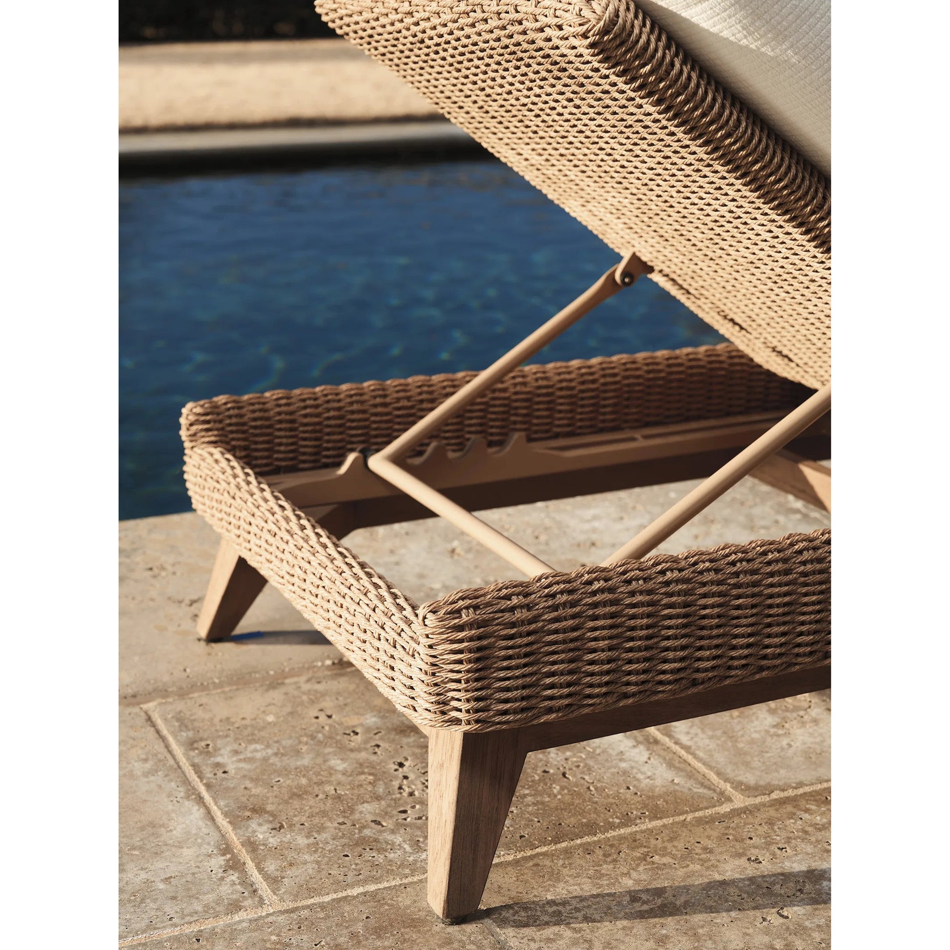 Isle of Palms Chaise Lounge by Tommy Bahama Outdoor in white, ivory and brown. Made from teak, rattan, fabric in a unique style.