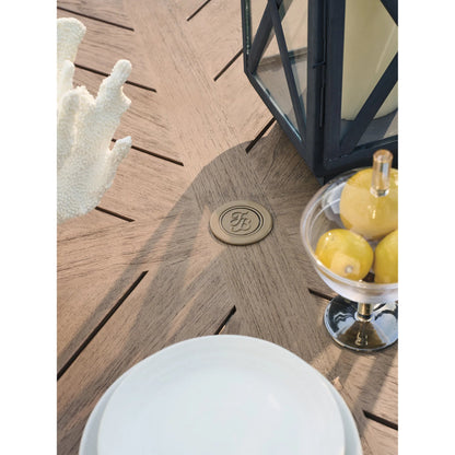 Isle of Palms Round Dining Table by Tommy Bahama Outdoor in brown. Made from teak in a unique style.