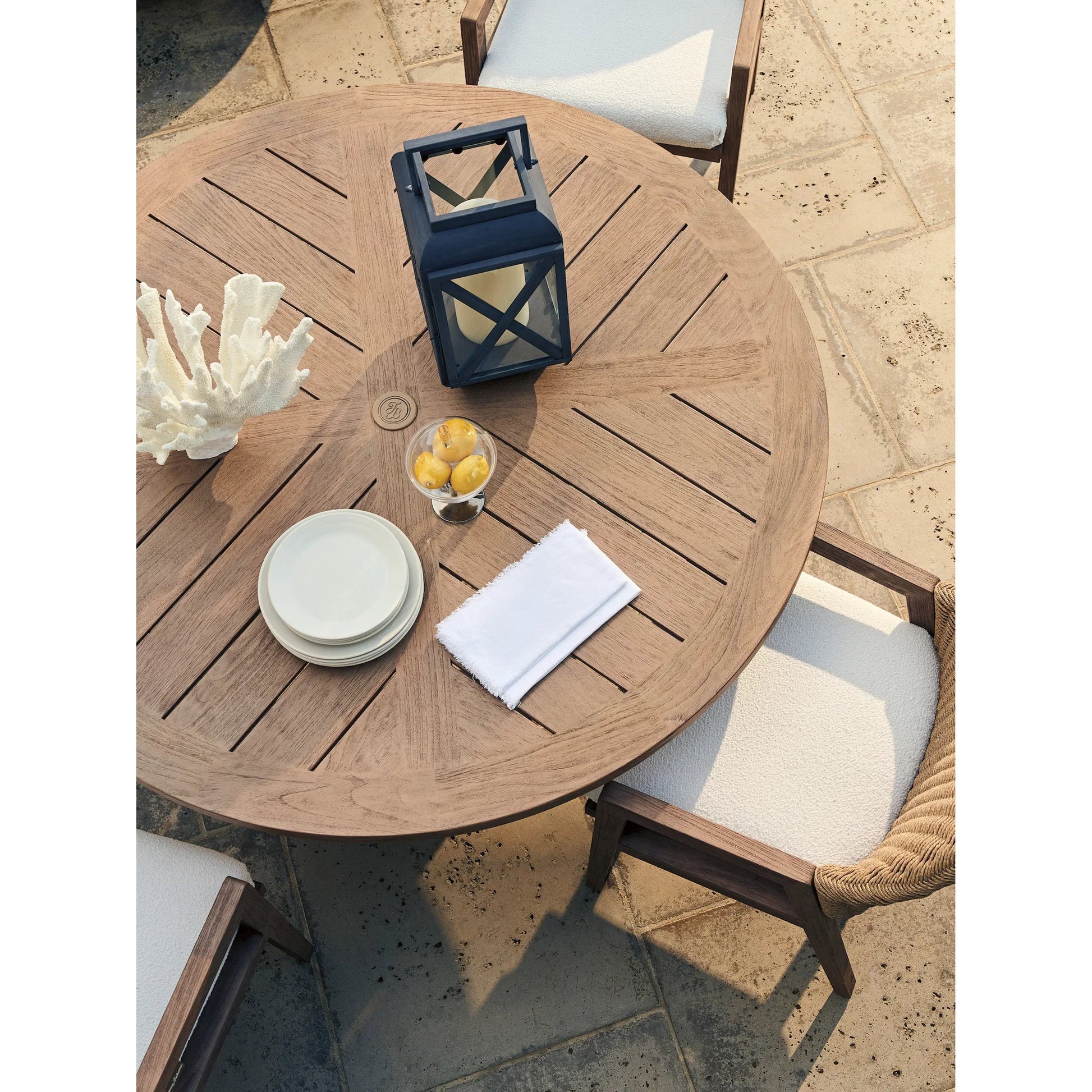 Isle of Palms Round Dining Table by Tommy Bahama Outdoor in brown. Made from teak in a unique style.