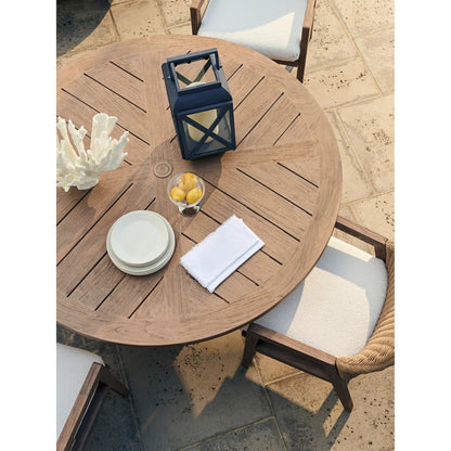 Isle of Palms Round Dining Table by Tommy Bahama Outdoor in brown. Made from teak in a unique style.