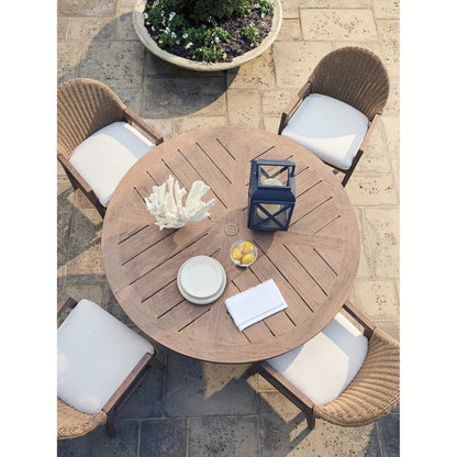 Isle of Palms Round Dining Table by Tommy Bahama Outdoor in brown. Made from teak in a unique style.