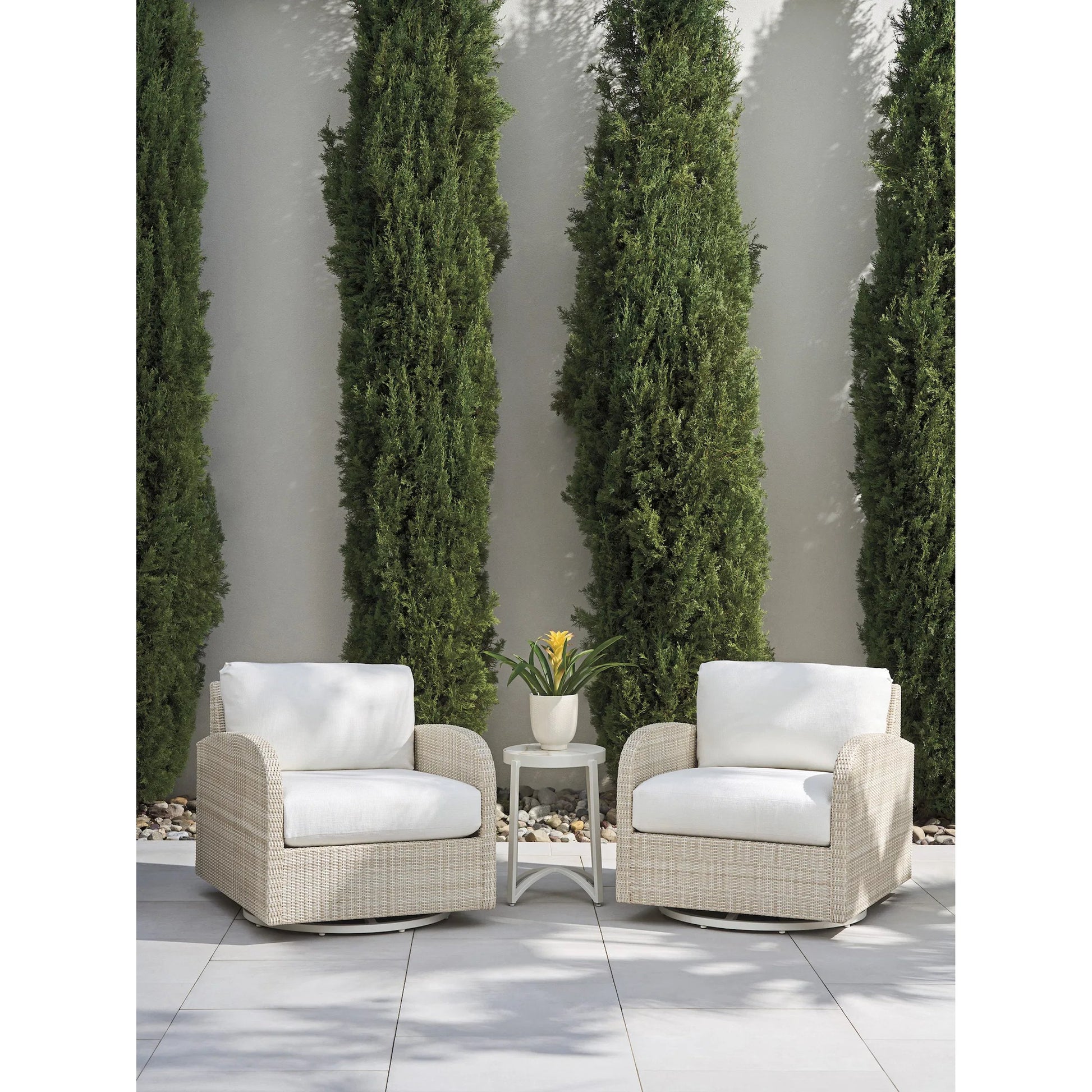 Sand Dune Swivel Lounge Chair by Tommy Bahama Outdoor in tan. Made from all-weather wicker in a unique style.