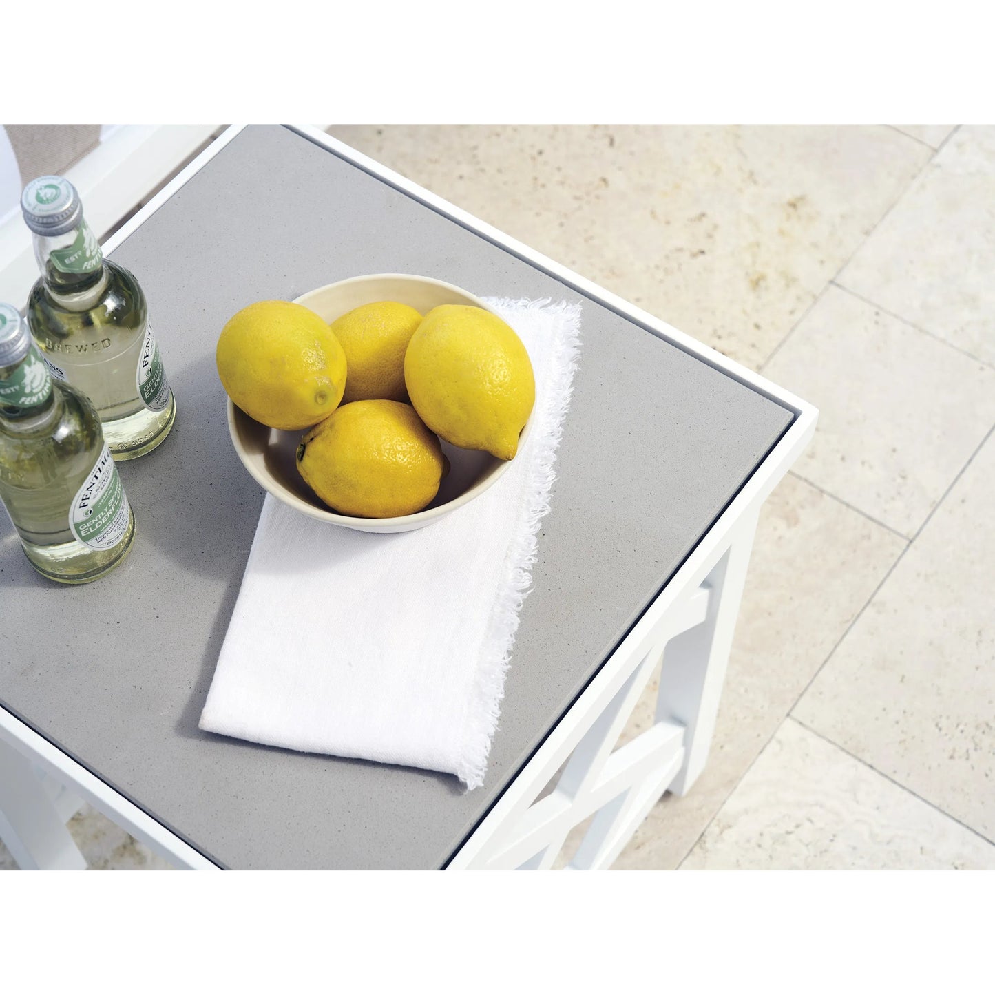003 SI-2540689 | Closeup | Island Classic Accent Table by Tommy Bahama Outdoor in white. Made from quartz, aluminum, fabric in a unique style.