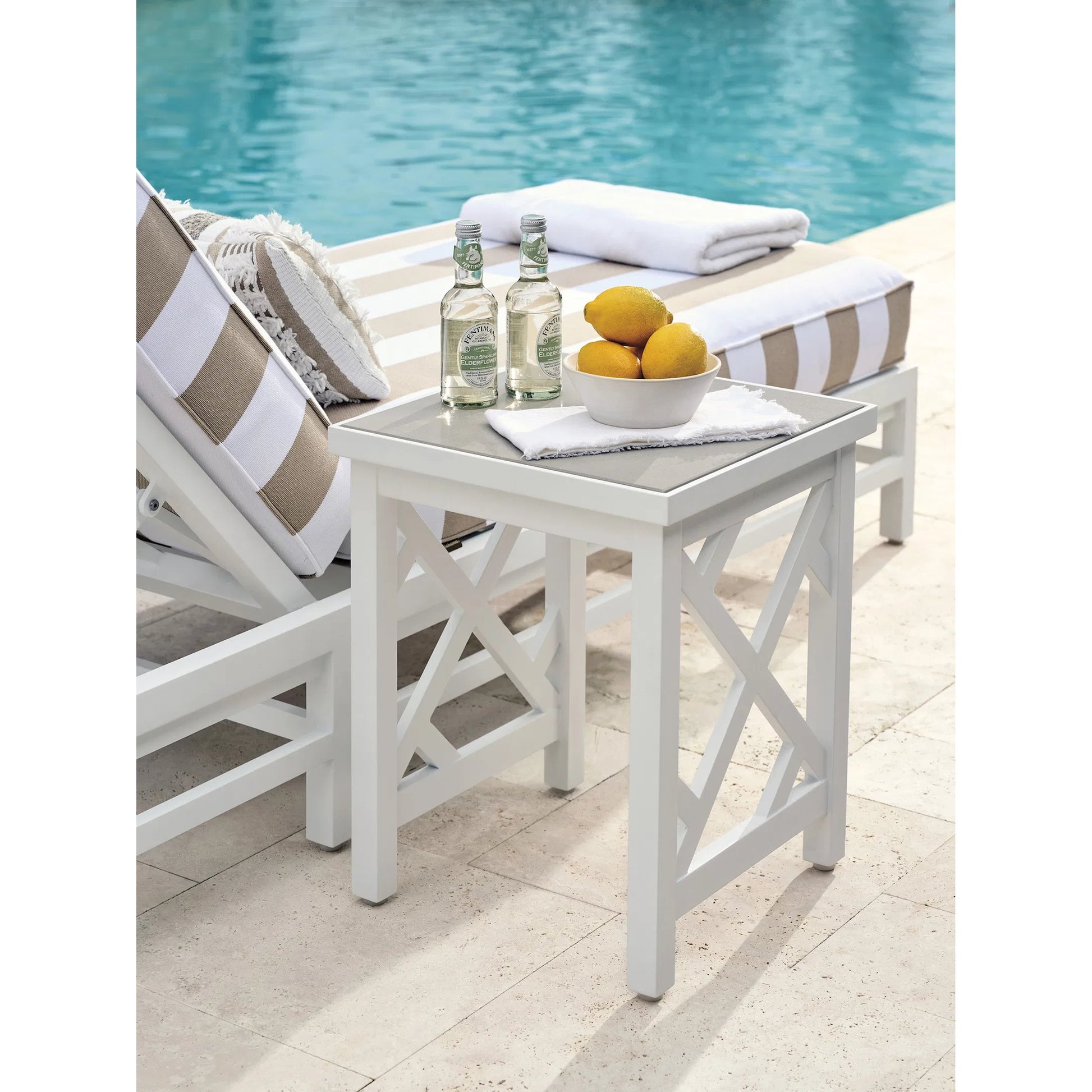 Island Classic Accent Table by Tommy Bahama Outdoor in white. Made from quartz, aluminum, fabric in a unique style.