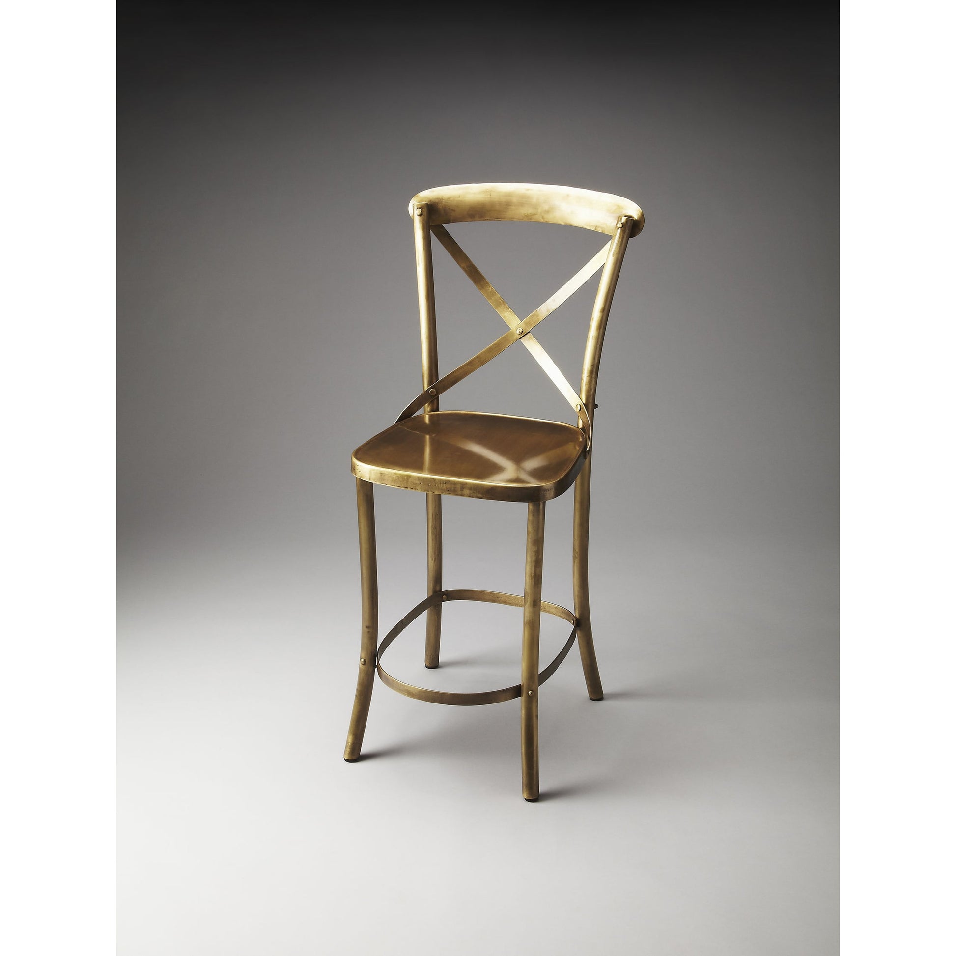 Bar Stool by Butler Specialty Company in gold and industrial chic. Made from iron in a modern style.