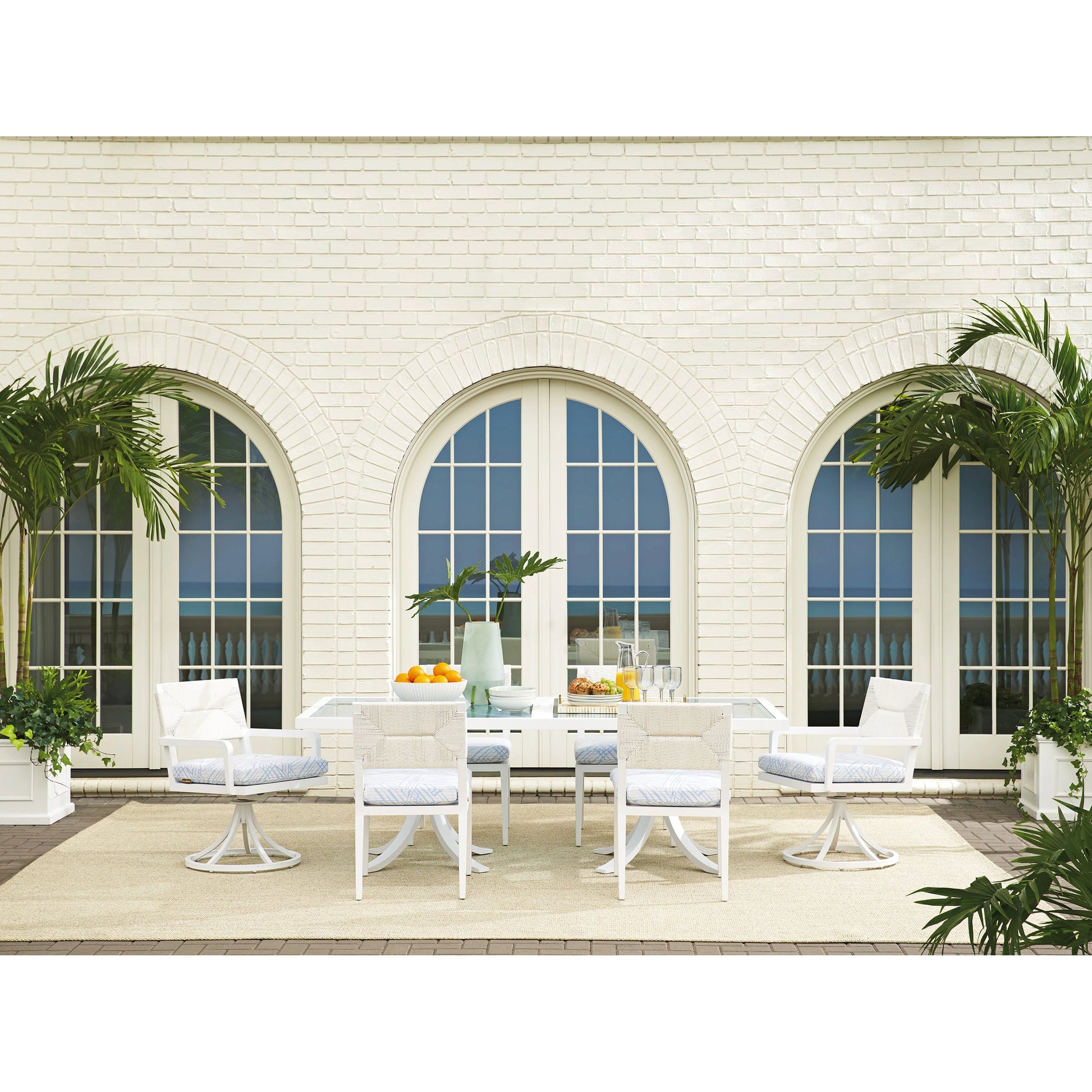 Ocean Breeze Promenade Rectangular Dining Table by Tommy Bahama Outdoor in white. Made from unique in a coastal style.