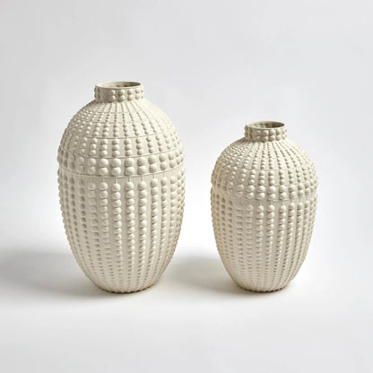 Nail Head Vase by Global Views in rustic white. Made from ceramic in a coastal style.