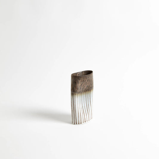 Reactive Bronze Stripe Oval Vase by Global Views. Made from porcelain in a eclectic & global style.
