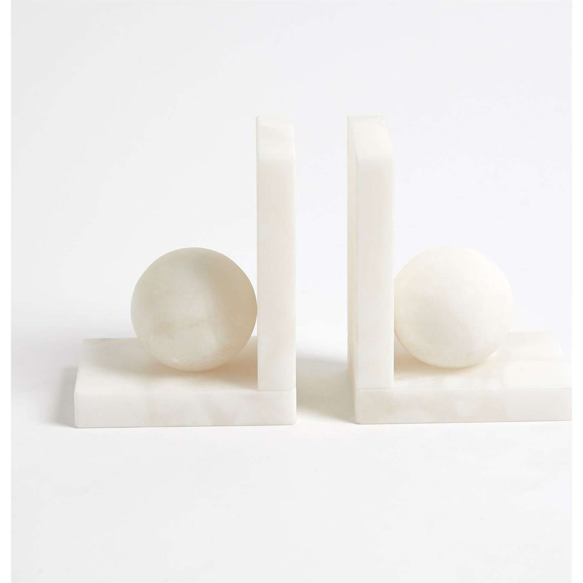 Alabaster Ball Bookends by Global Views. Made from alabaster in a modern style.