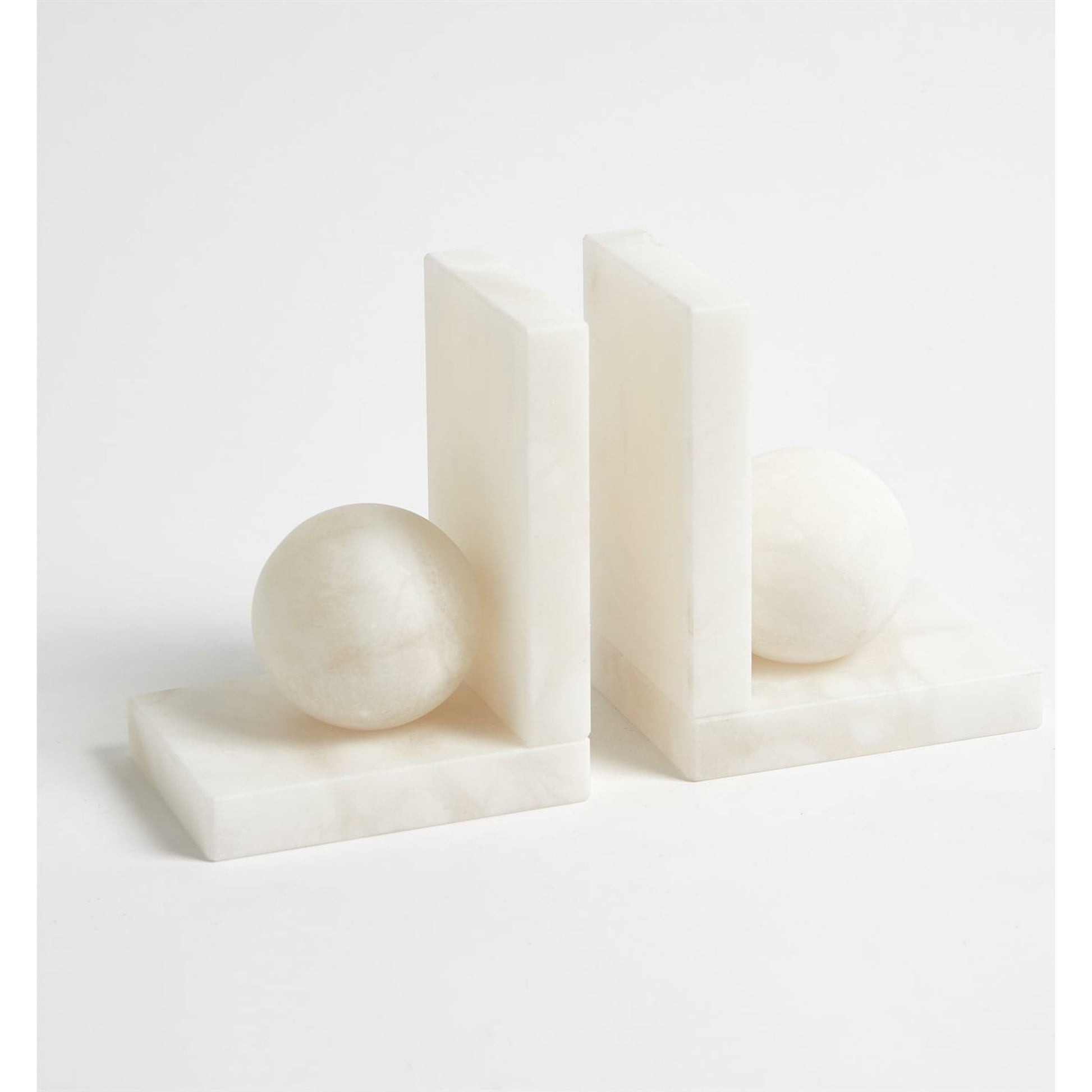 Alabaster Ball Bookends by Global Views. Made from alabaster in a modern style.
