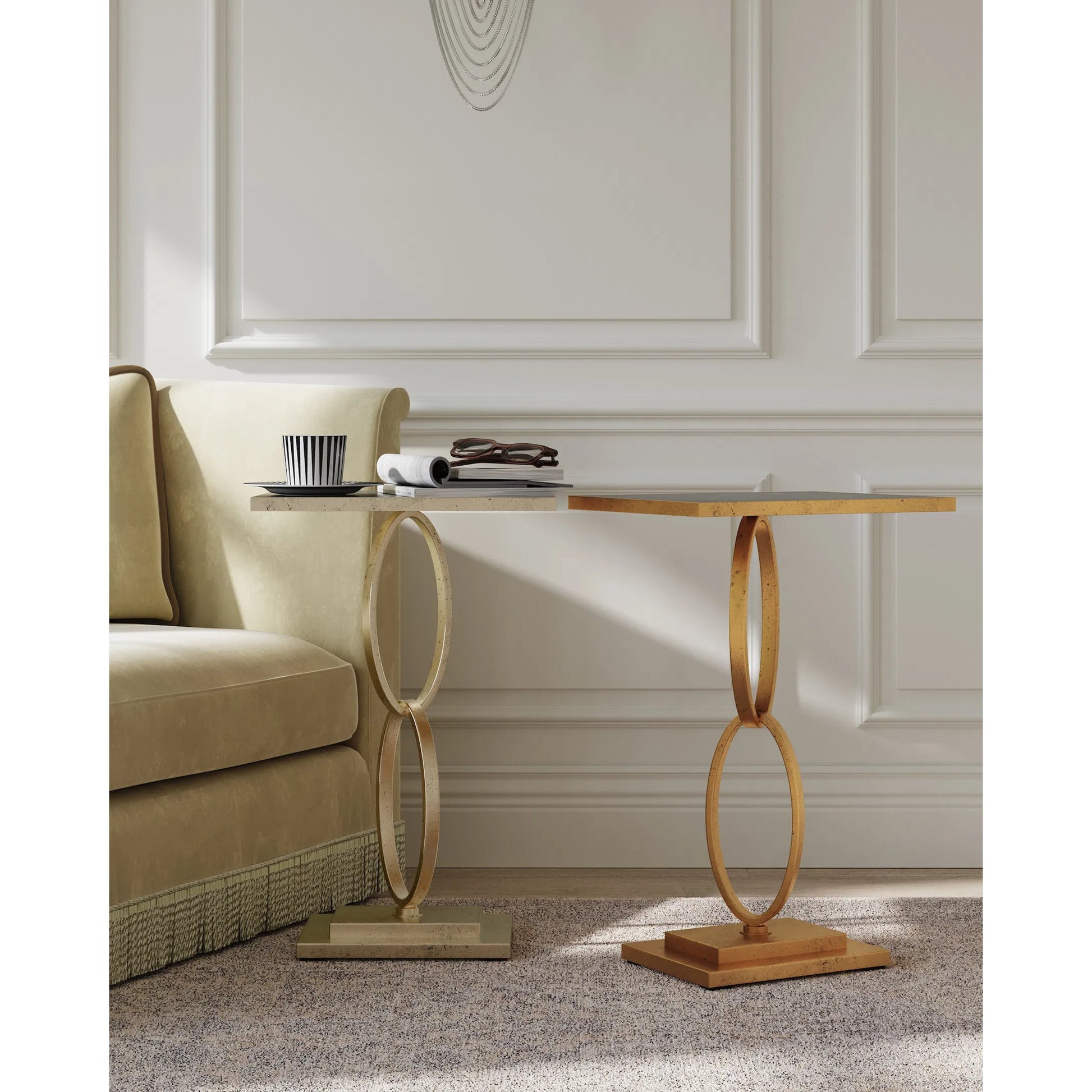 Bangle Accent Table by Currey and Company in gold leaf. Made from iron, glass in a modern style.