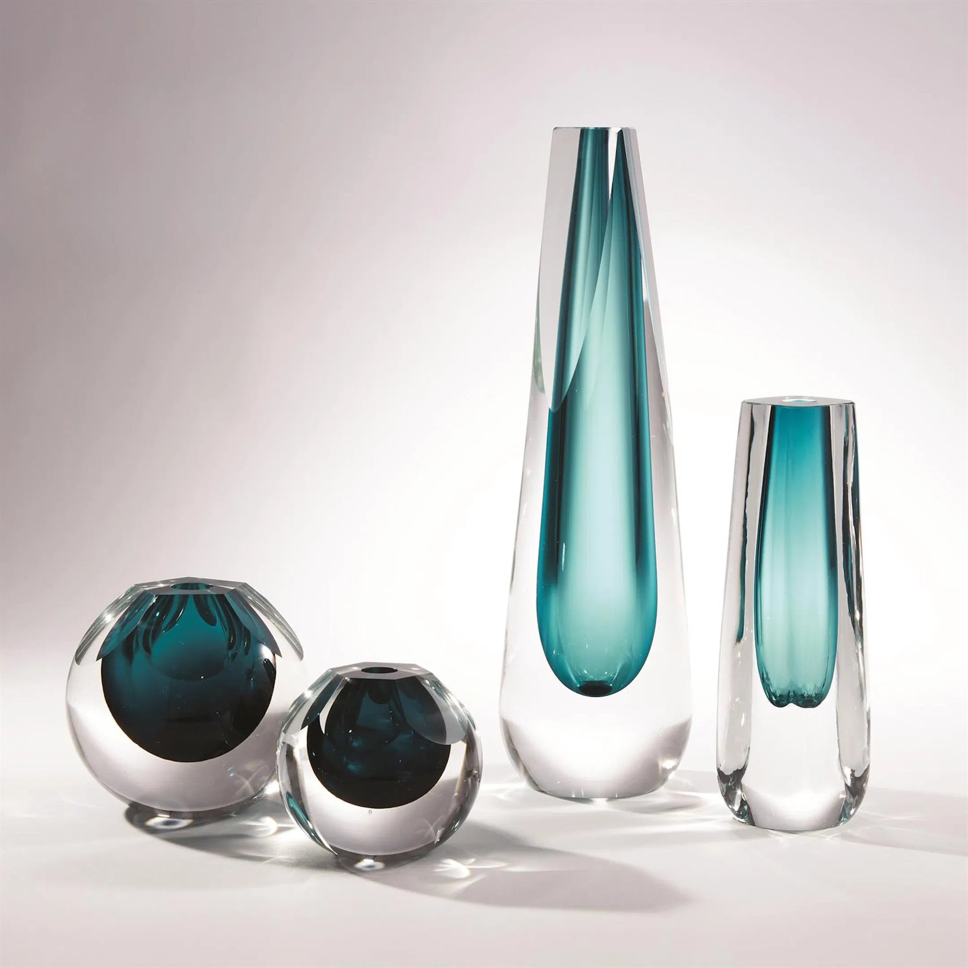 Pentagon Cut Glass Vase by Global Views. Made from art glass in a coastal style.