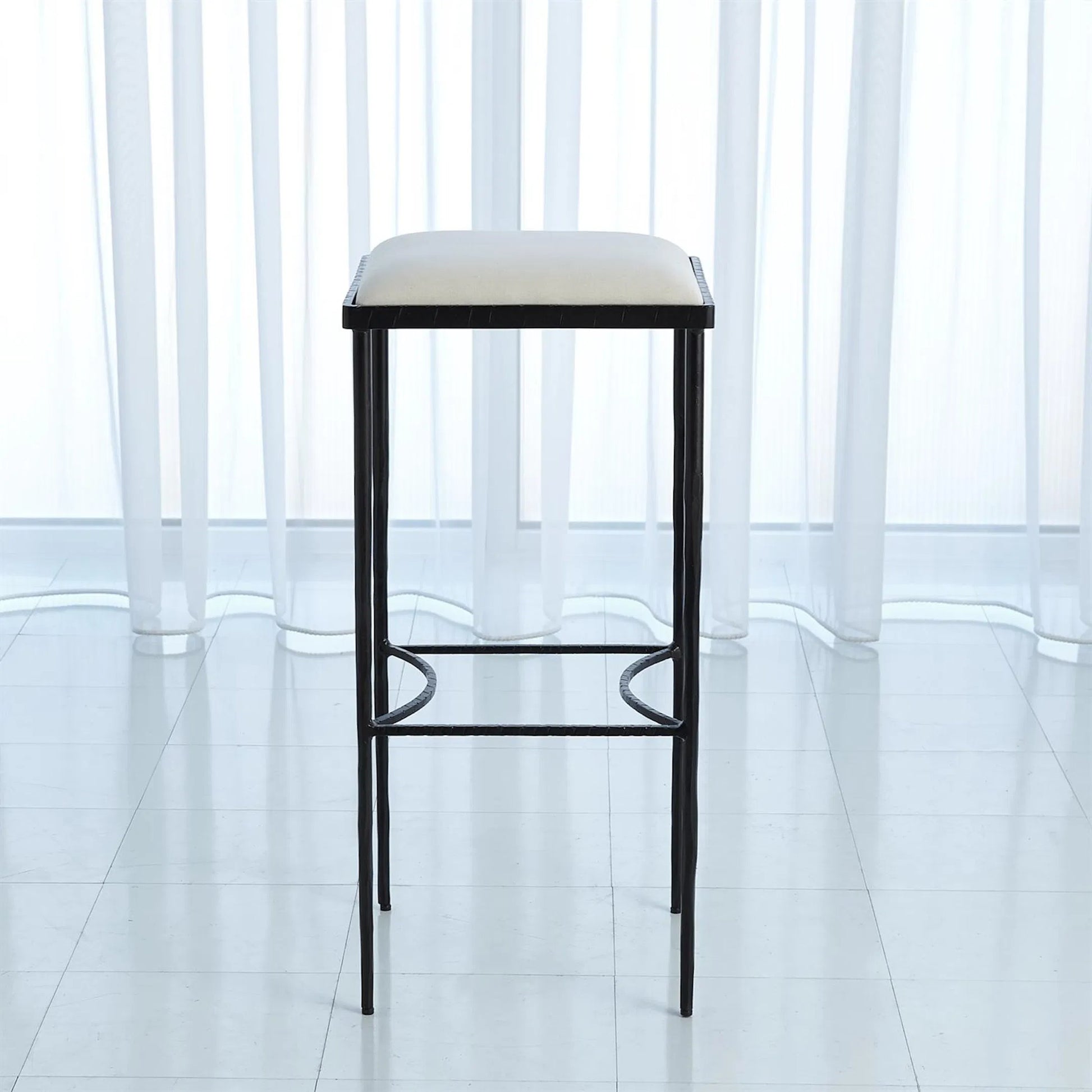 Hammered Counter Stool by Global Views in rustic gun metal powder coat. Made from iron in a transitional style.