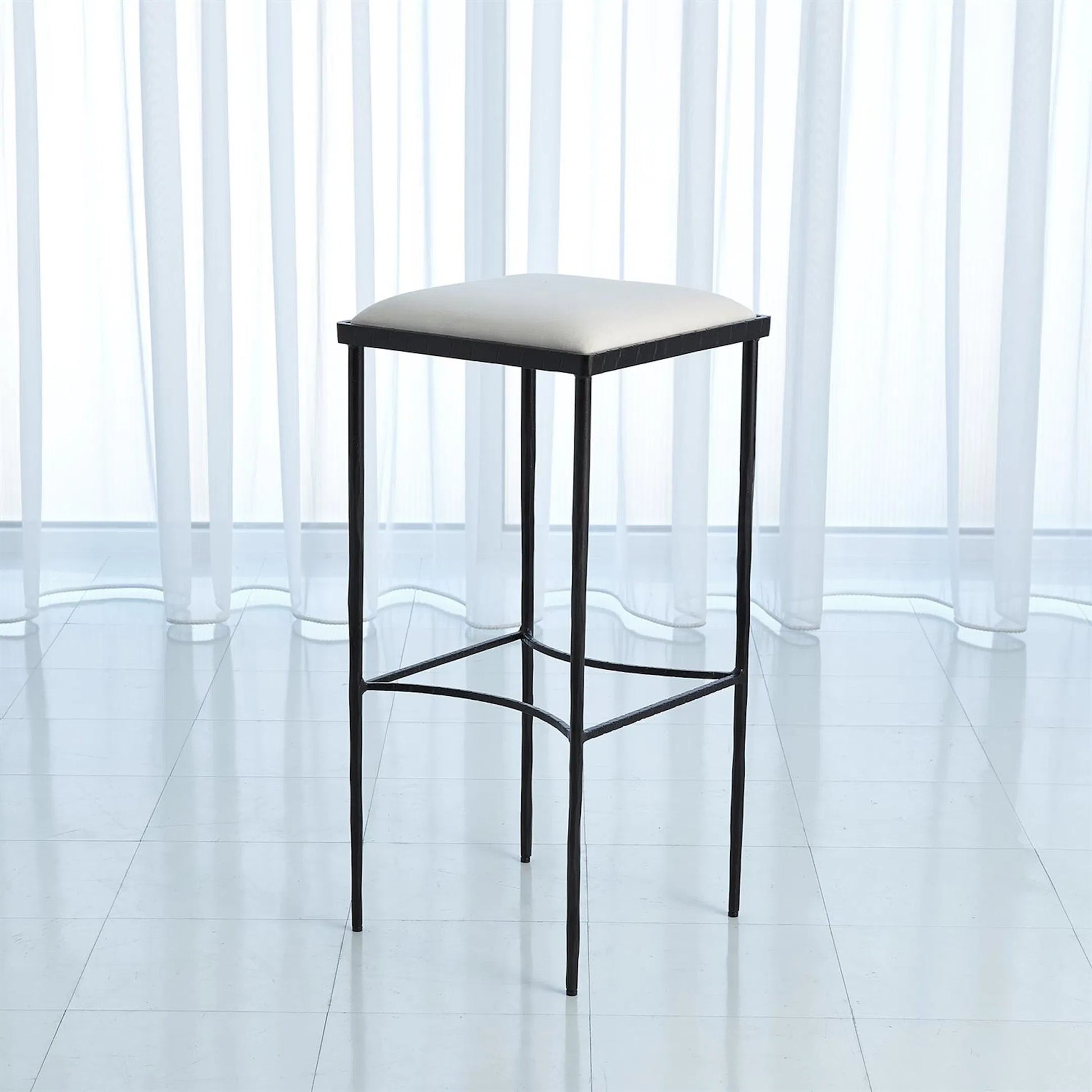 Hammered Counter Stool by Global Views in rustic gun metal powder coat. Made from iron in a transitional style.