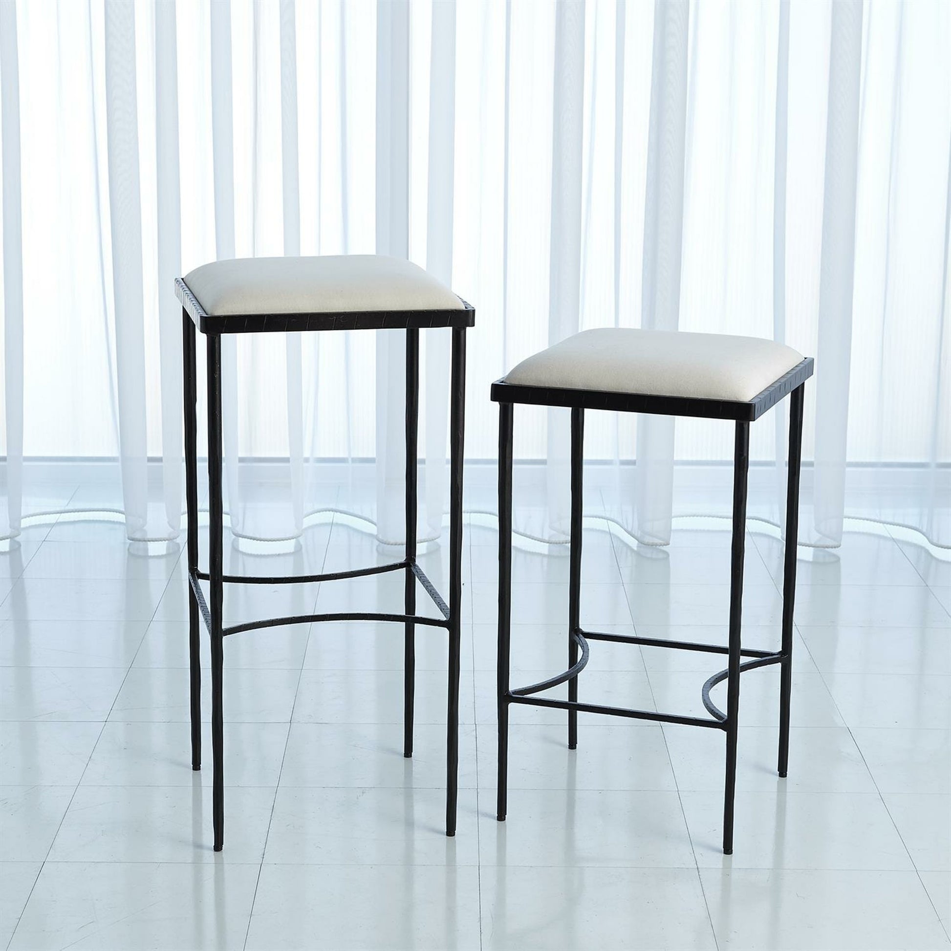 Hammered Bar Stool by Global Views. Made from iron in a modern style.