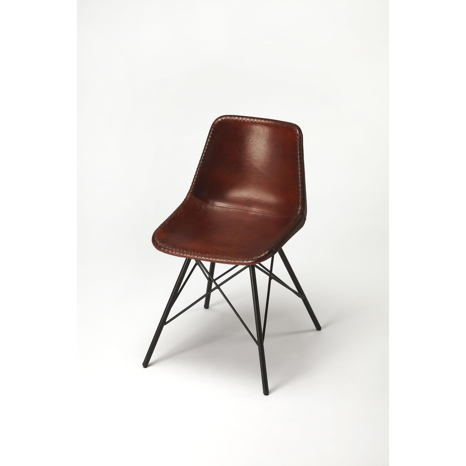 Inland Side Chair by Butler Specialty Company. Made from leather, iron in a traditional style.