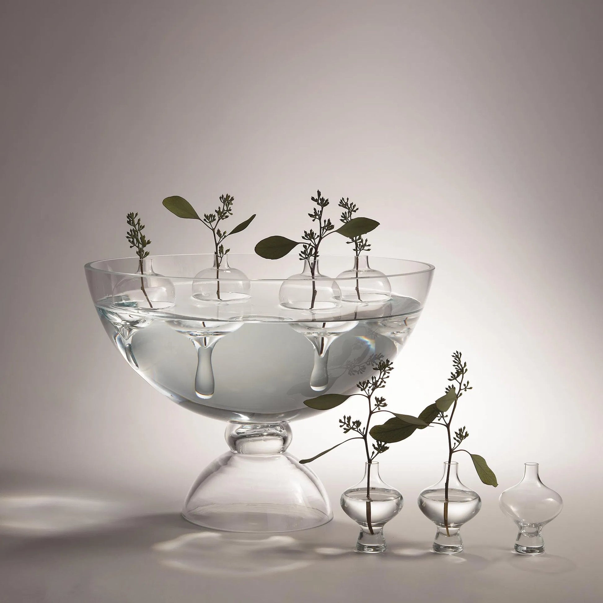 Mini Floating Droplet Vase by Global Views. Made from glass in a modern style.